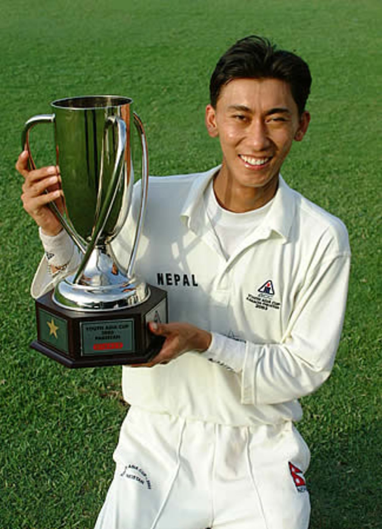 Shakti Prasad the Nepal Captain poses with the trophy, Final: Malaysia Under-19s v Nepal Under-19s at National Stadium, Karachi, Youth Asia Cup 2003, 27 July 2003.