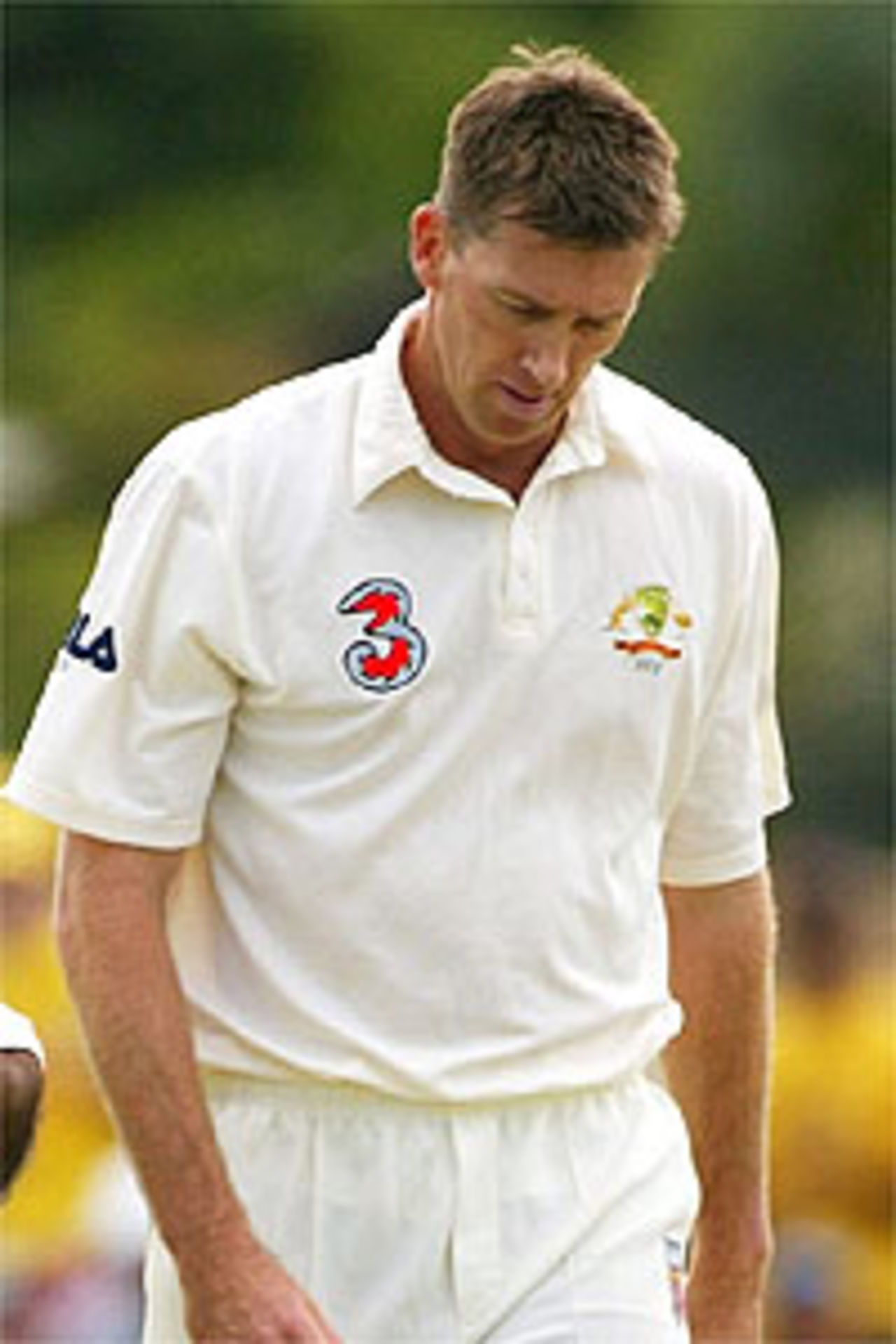 CAIRNS, AUSTRALIA - JULY 25: Glenn McGrath of Australia looks on as the Bangladesh batsman take a run during day one of The Second Test between Australia and Bangladesh played on July 25, 2003 at The Bundaberg Rum Stadium, Cairns, Australia