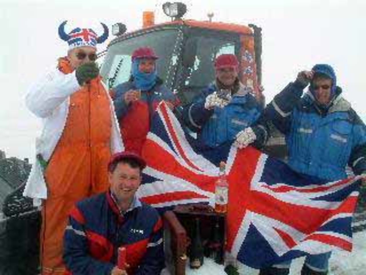 Blowers and the team flying the flag on the glacier, July 2003