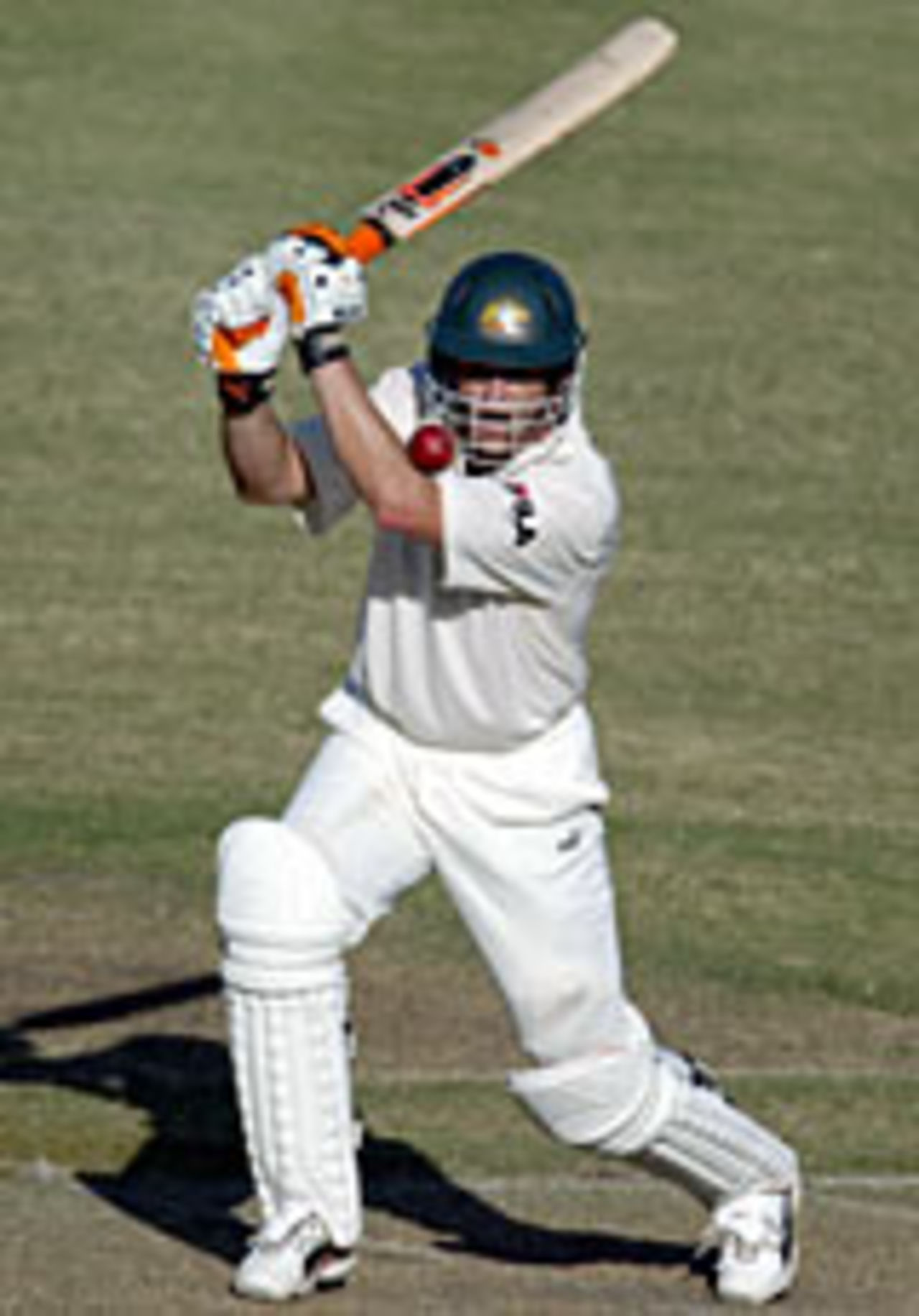 Adam Gilchrist drives during his innings of 80, Australia v Sri Lanka, Darwin, July 2, 2004