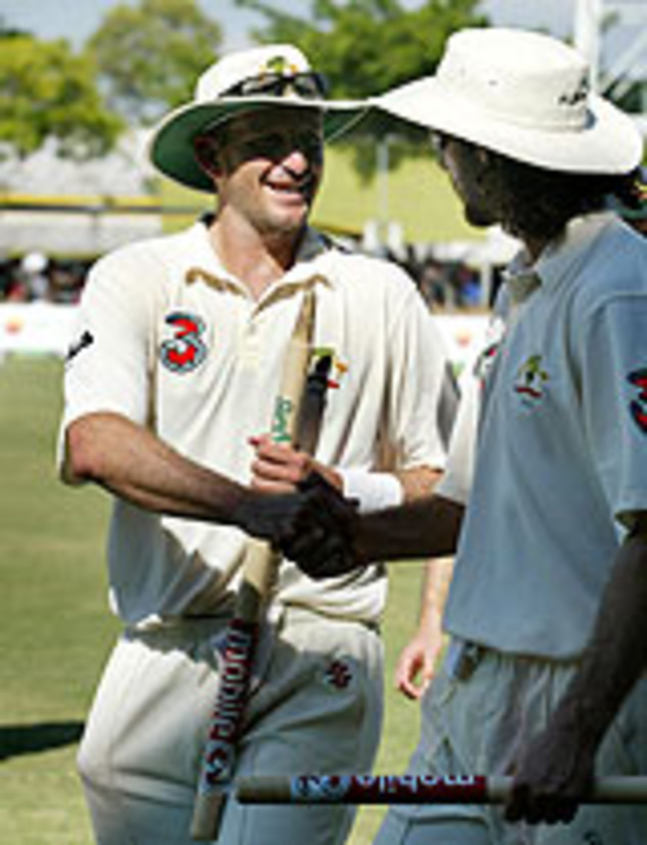 Michael Kasprowicz is congratulated by Jason Gillespie, Australia v Sri Lanka, Darwin, July 3, 2004