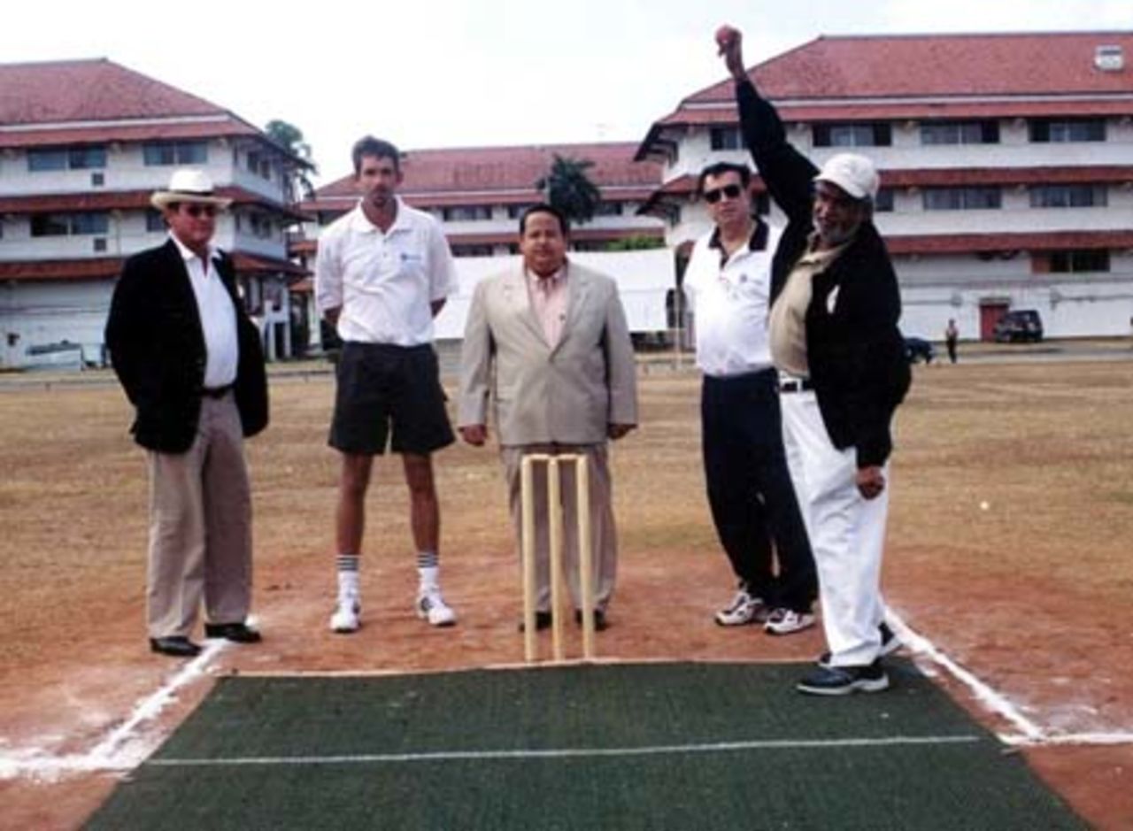 First Ball of the 2004 Affiliates Tournament, Panama City bowled by Ringo Mayani, President PCA. The Minister of Sport and ICC Americas watch the action