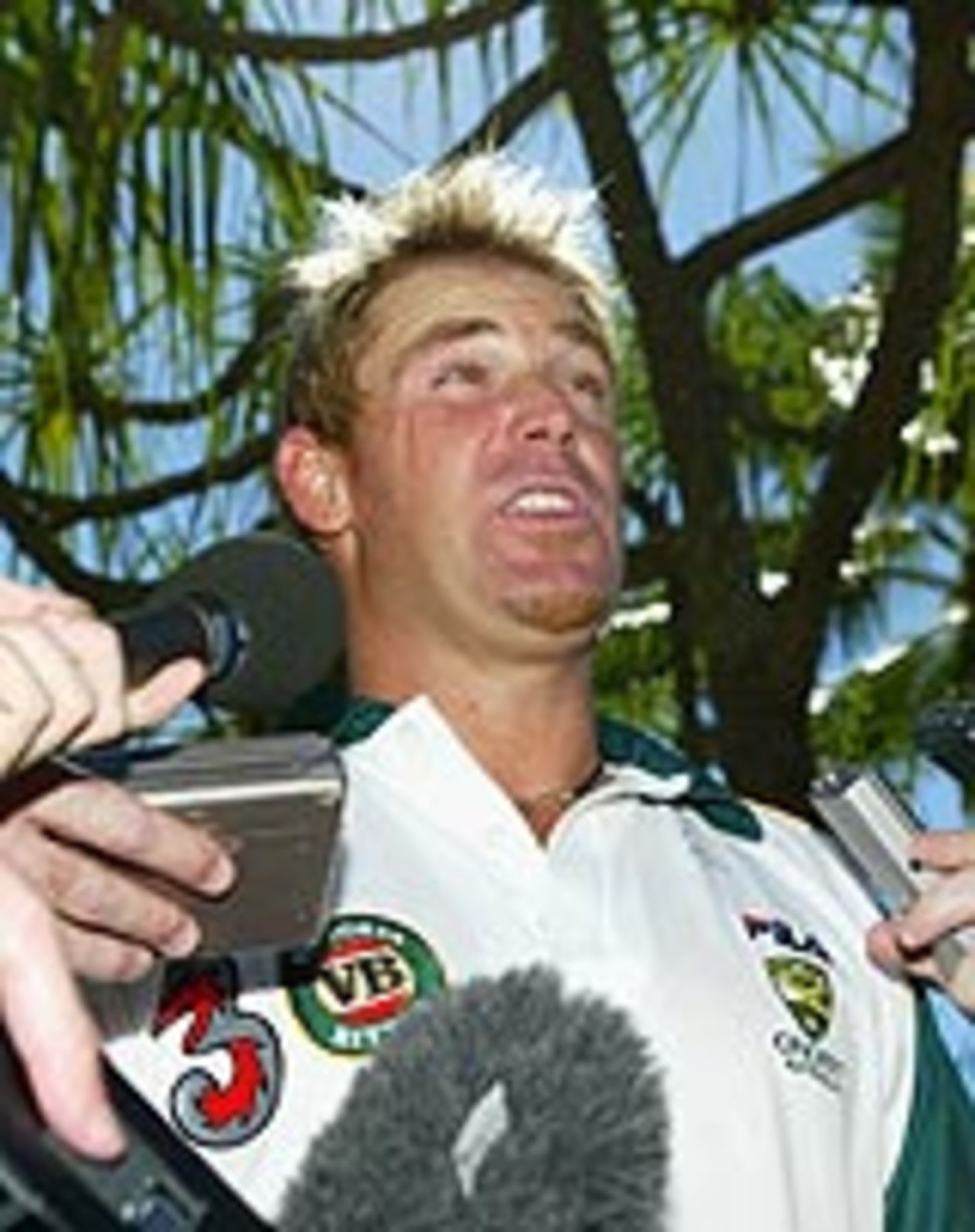 Shane Warne talks to the media, Cairns, July 7, 2004