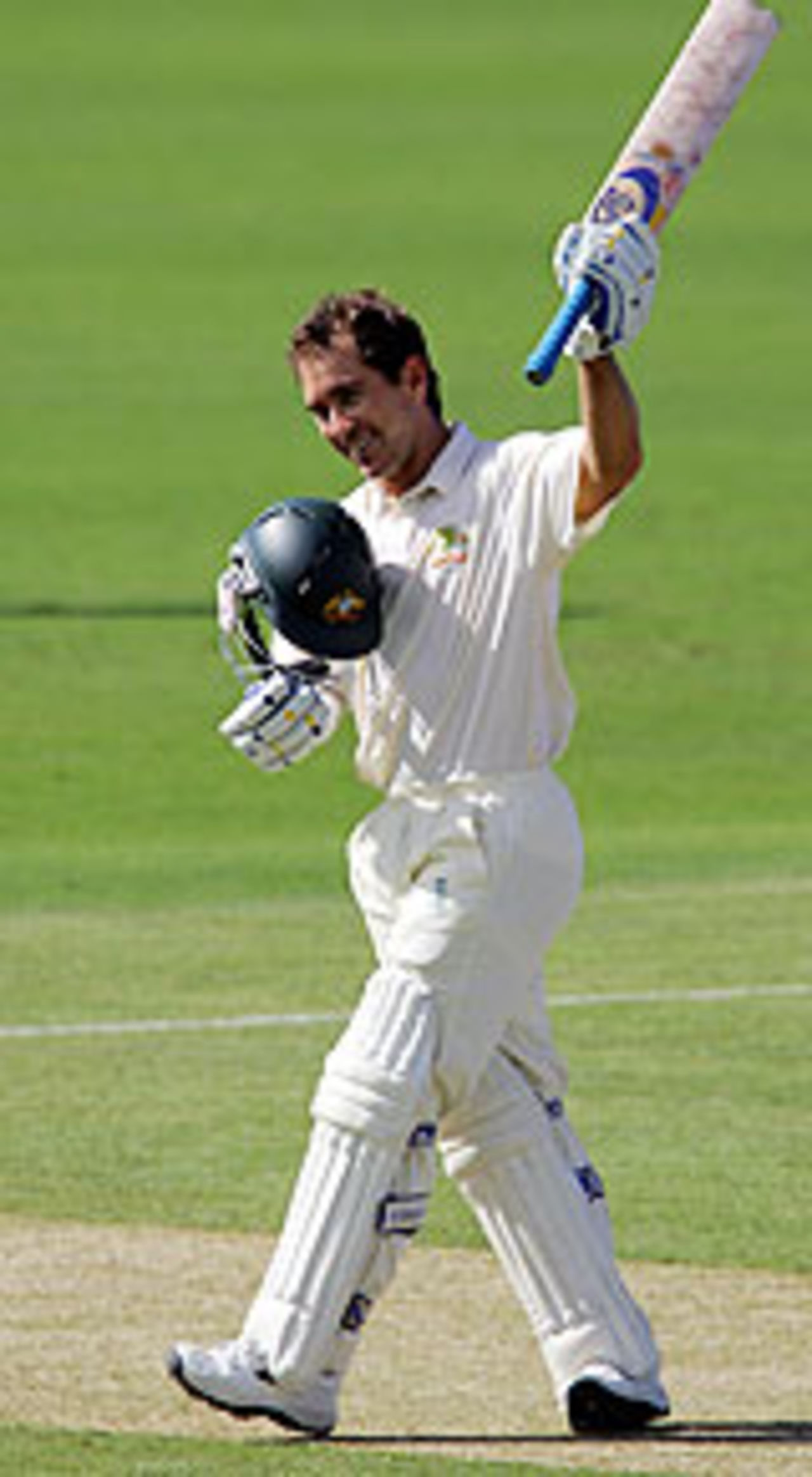 Justin Langer raises his bat after reaching his hundred, Australia v Sri Lanka, 2nd Test, Cairns, 1st day, July 9, 2004