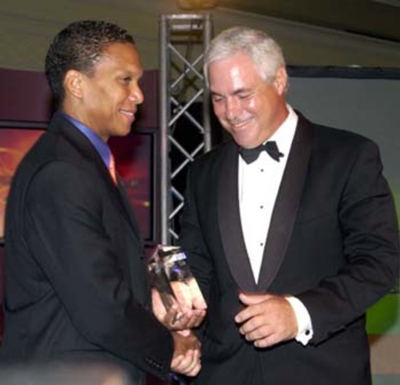 Chris Dehring, Managing Director and CEO, ICC CWC WI 2007 Inc. presents the ICC CWC finals package to Barbados representative Chris de Caires.