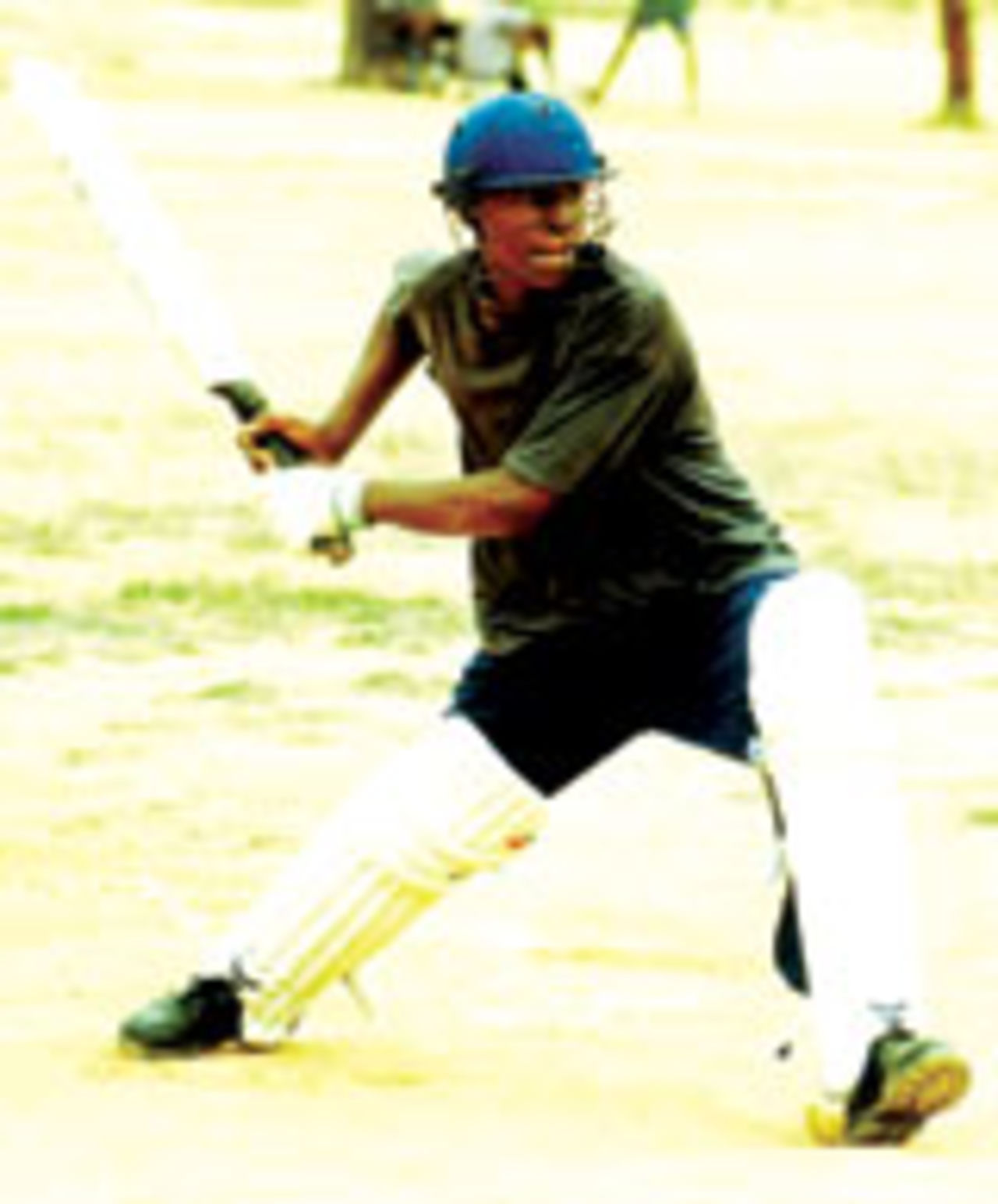 A young Zimbabwean cricketer shapes for a cover drive, July 15 2004