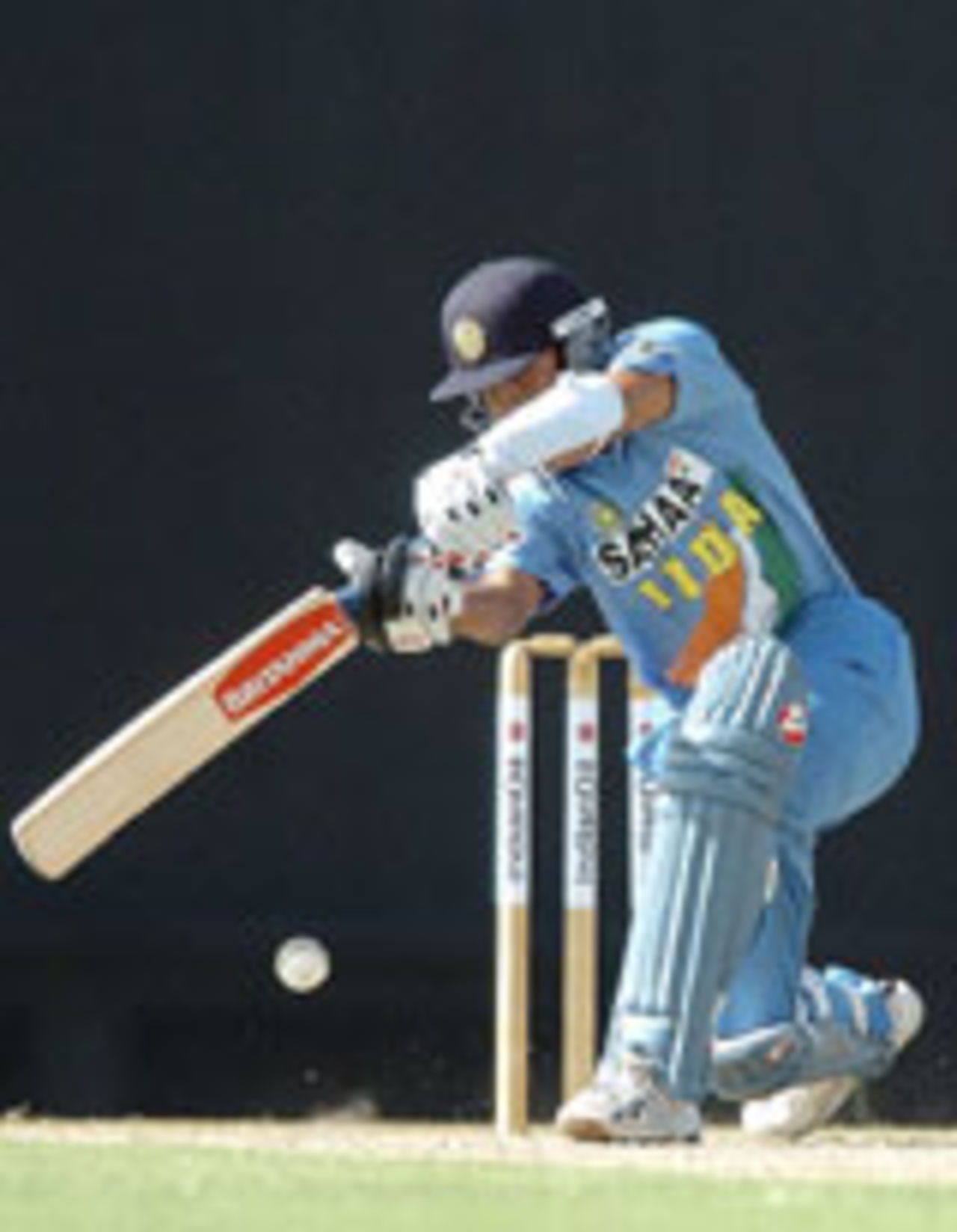 Rahul Dravid drives on his way to a fluent half-century, India v UAE, Asia Cup, July 16 2004