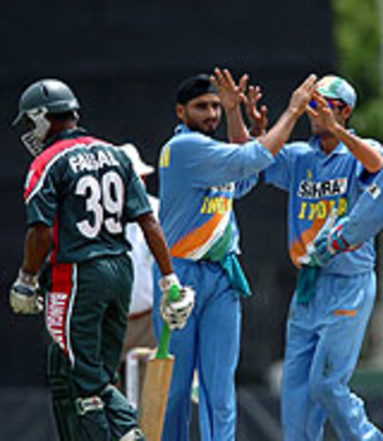 Harbhajan Singh celebrates a first wicket on his return, Bangladesh v India, Asia Cup, July 21, 2004