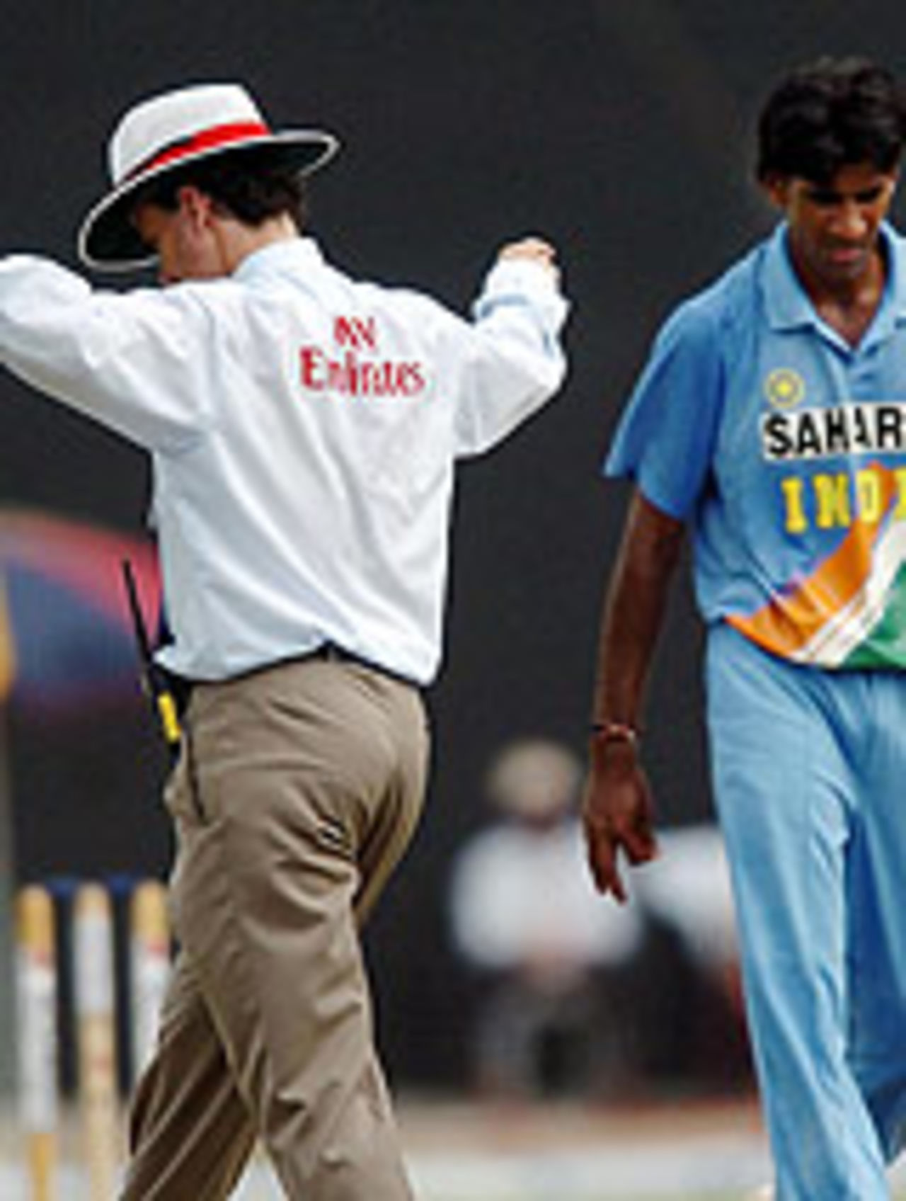 Lakshmipathy Balaji walks past an umpire signalling wide, Pakistan v India, Asia Cup, 10th match, Colombo, 25 July, 2004