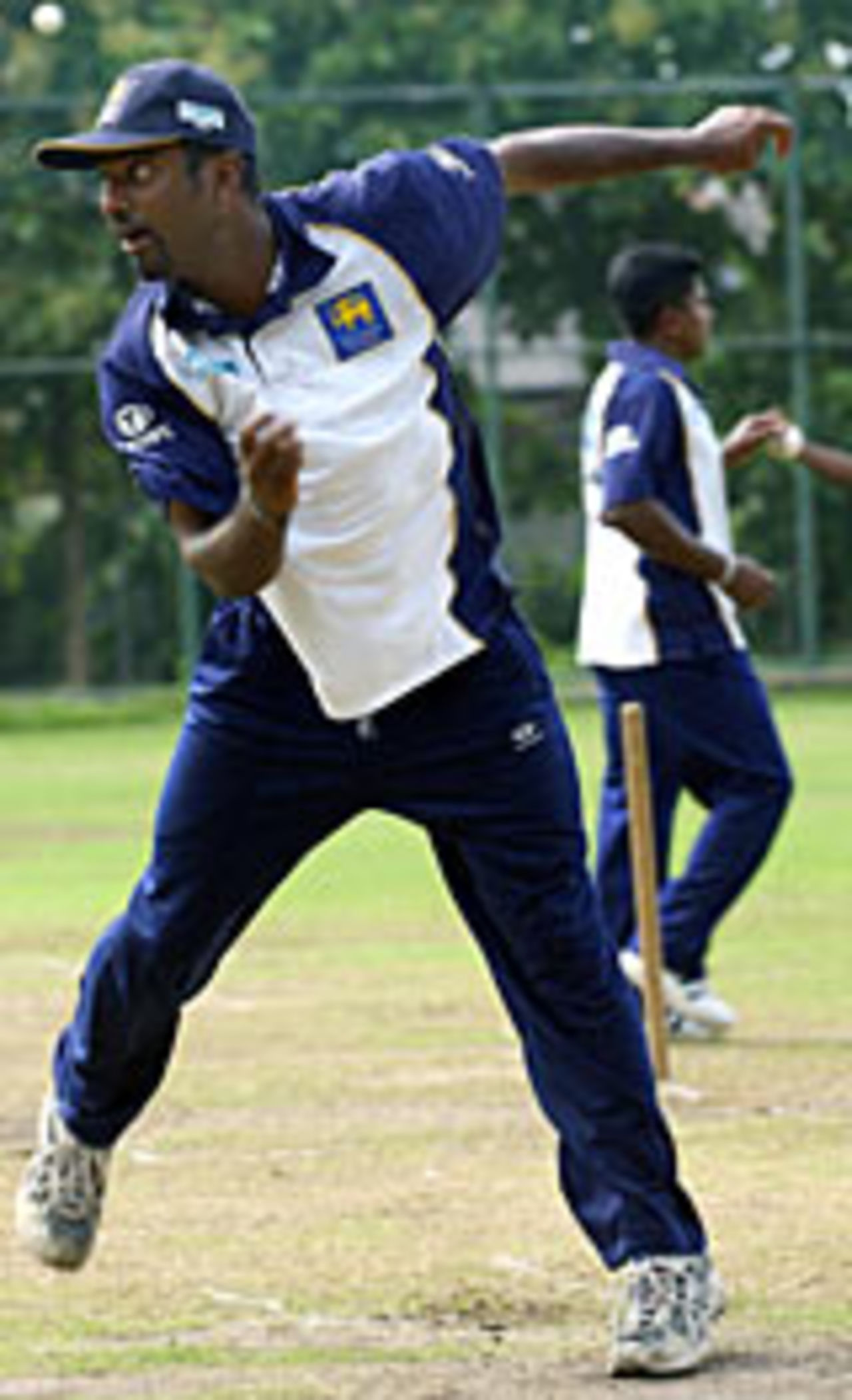 Muttiah Muralitharan practises in the nets in Colombo ahead of the Asia Cup match against India, July 26, 2004