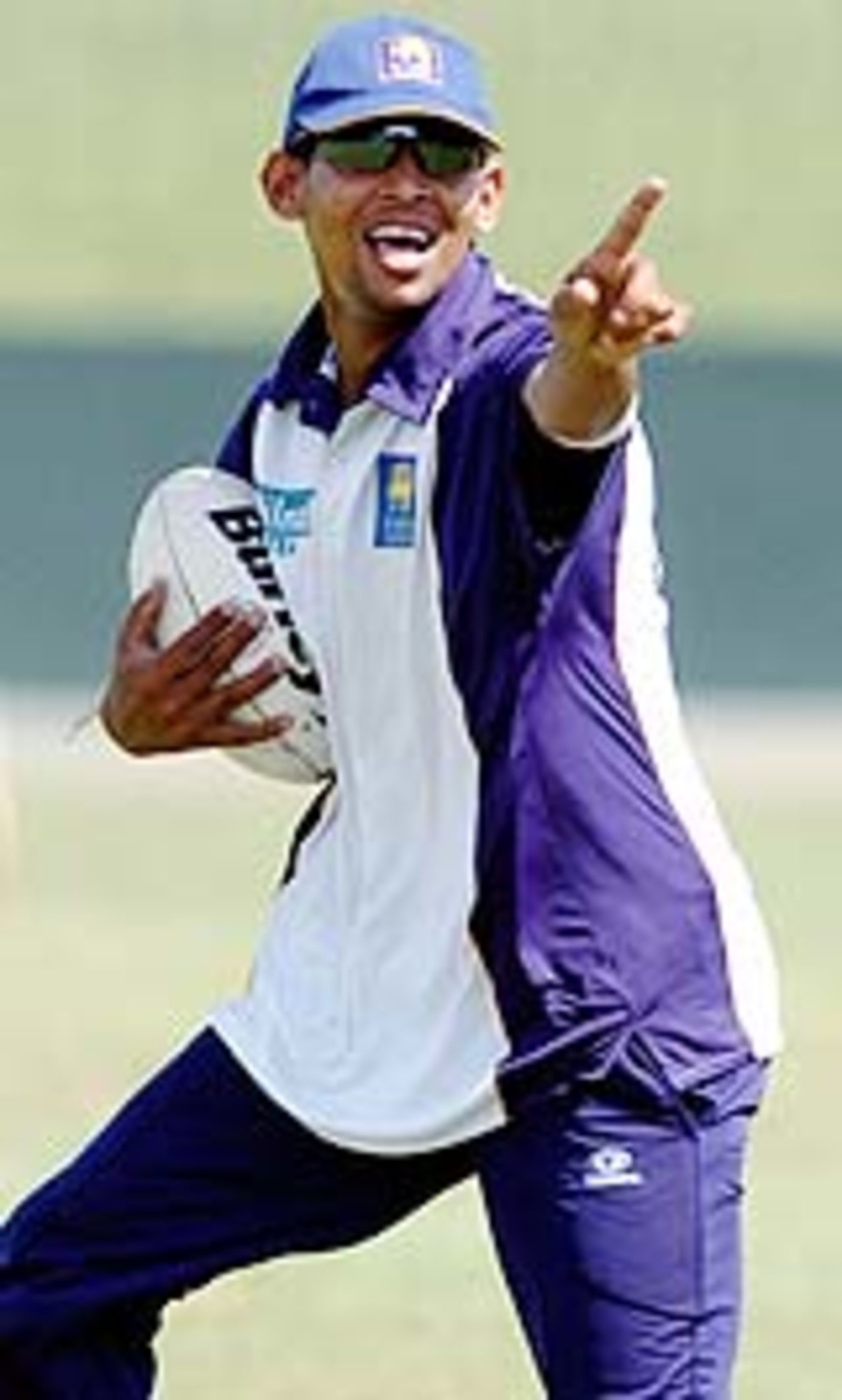 Tillakaratne Dilshan plays rugby during practice, Colombo, July 30, 2004
