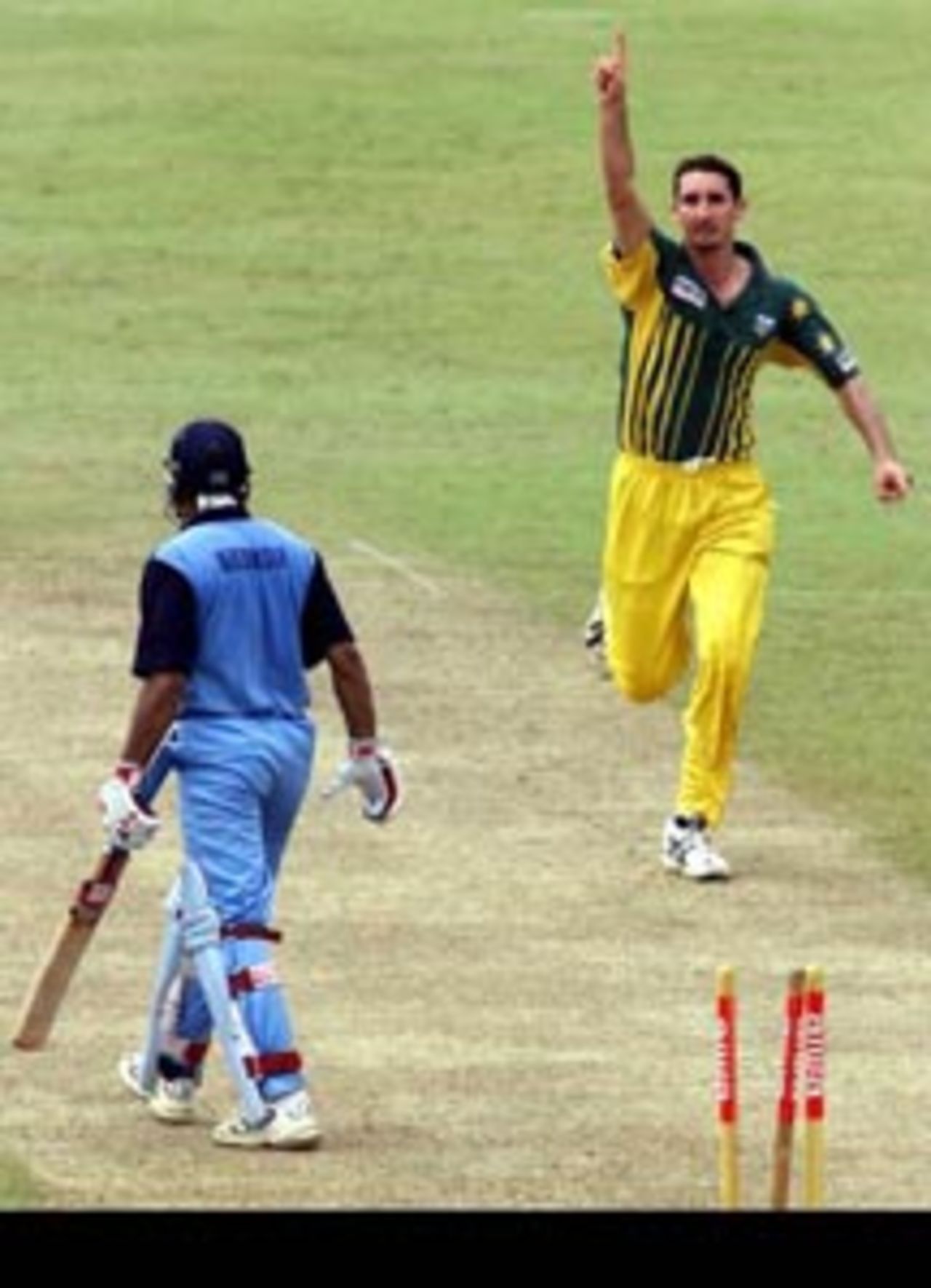 28th August 1999: Jason Gillespie of Australia bowls Khurasiya of India, during the match between India and Australia at Singhalese Stadium, Colombo, Sri Lanka.