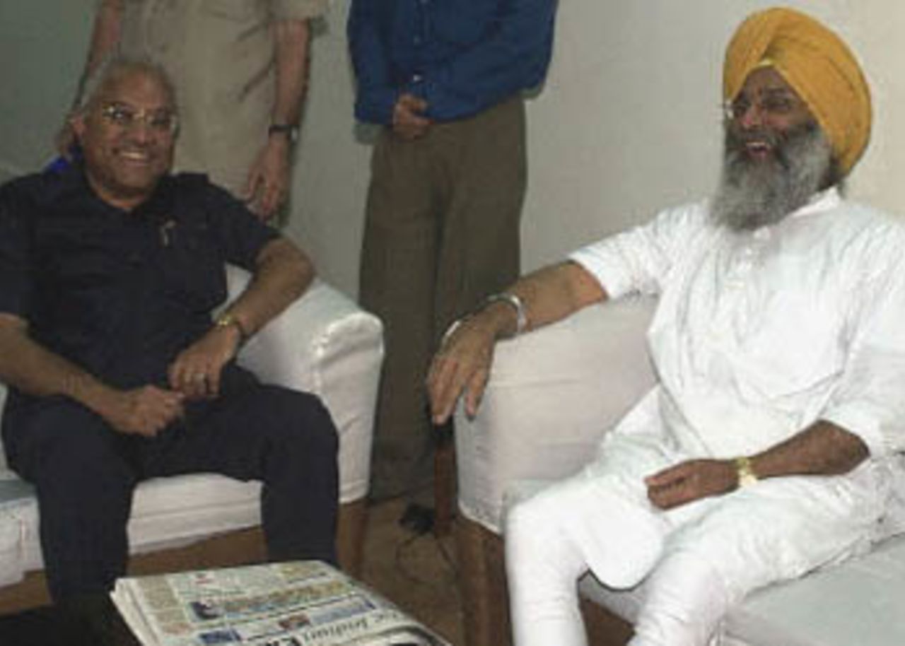 Indian Sports Minister S.S. Dhindsa (L) and President of the Indian cricket board A.C. Muthiah (R) share a lighter moment as they pose for photographers prior to their talks along in the sports ministry office in New Delhi 01 August 2000. The meeting between Cricket board members and sports ministry officials was held to discuss the code of conduct of cricket players following match-fixing allegations against several cricket players and officials.