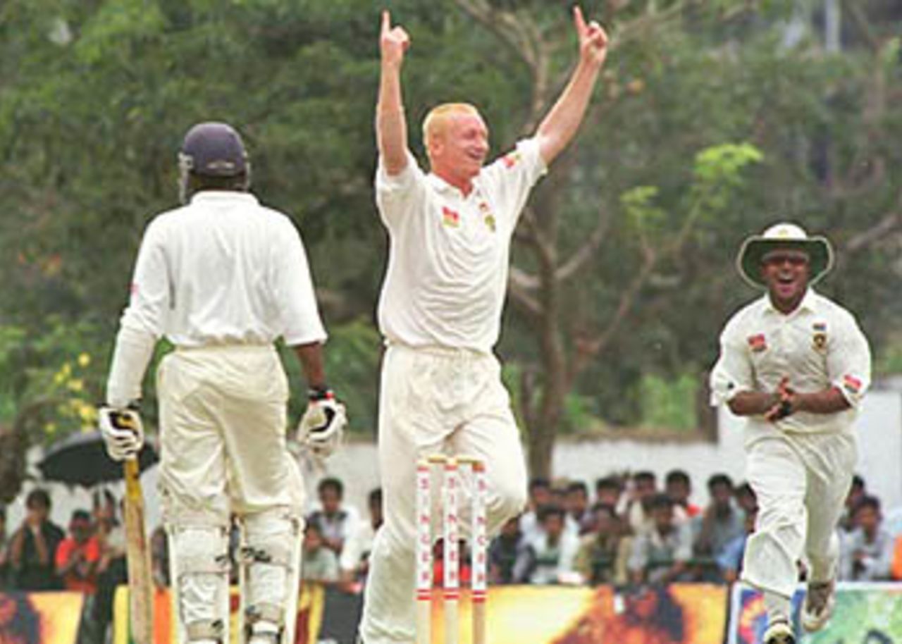 Nantie Hayward raises his arms in jubilation as Adams looks on, South Africa in Sri Lanka, 2000/01, 2nd Test, Sri Lanka v South Africa, Asgiriya Stadium, Kandy, 30July-03August 2000 (Day 4).