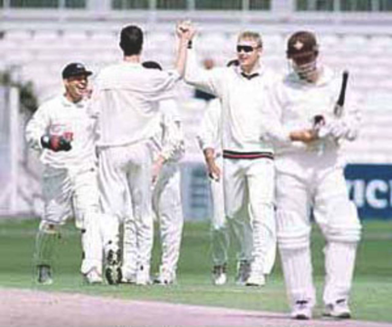 Lancashire teammates celebrate the fall of Ian ward, PPP healthcare County Championship Division One, 2000, Surrey v Lancashire, Kennington Oval, London, 02-05 August 2000(Day 1).