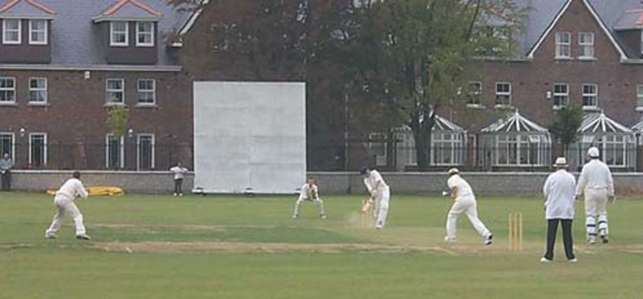 Maarten van Ierschot (Holland) hits the ball down onto his own foot off Ryan Bell (Ireland), and is about to be caught by McKenzie at short cover