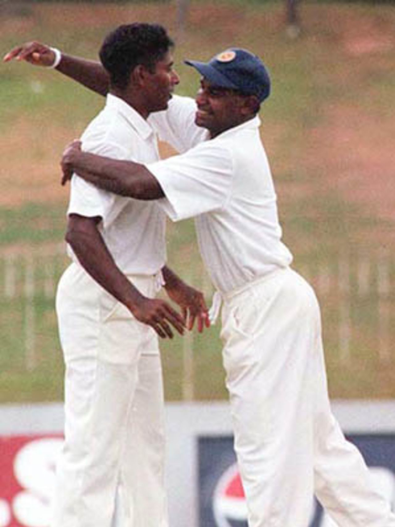 Chaminda Vaas celebrates with the Sri Lankan captain Jayasuriya, South Africa in Sri Lanka, 2000/01, 3rd Test, Sri Lanka v South Africa, Sinhalese Sports Club Ground, Colombo, 06-10 August 2000 (Day 1).