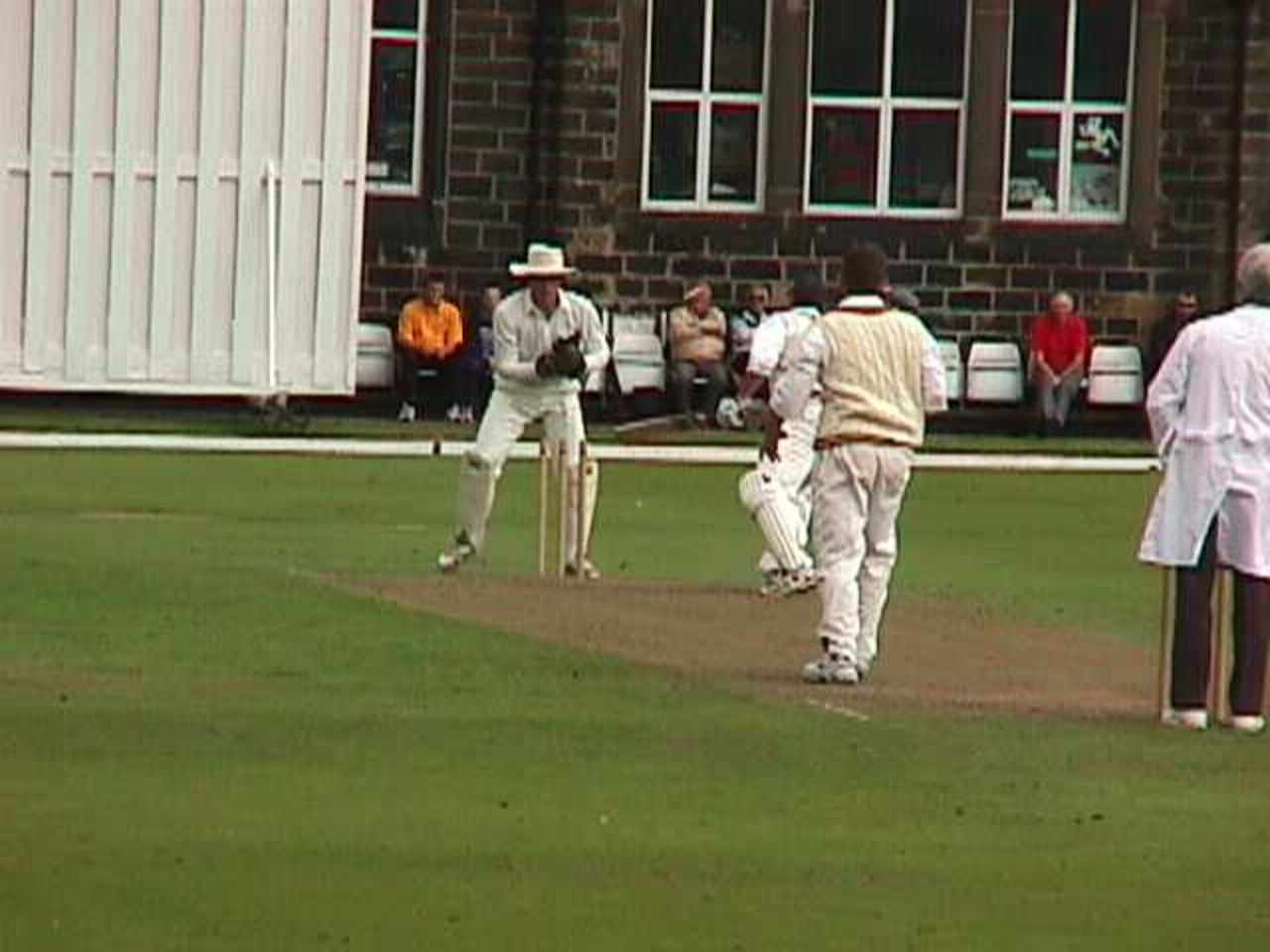 Andy Smith removes the bails of the Todmorden captain Nigel Hunter