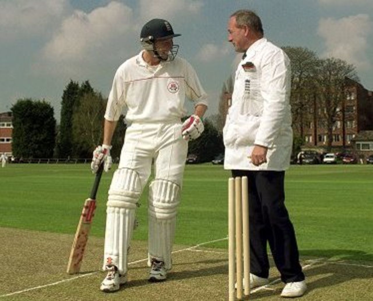 7 Apr 2000: Michael Atherton of Lancashire talks to umpire Alan Whitehead during the three day match against Cambridge University at Fenner's in Cambridge, England. Lancashire won the match by 170 runs.