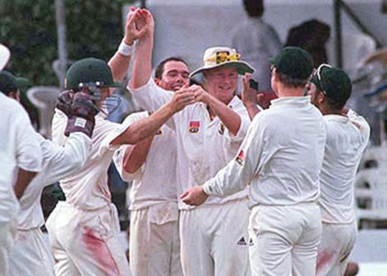Lance Klusener being congratulated by his teammates after he took a brilliant catch diving to his left to dismiss Russel Arnold, South Africa in Sri Lanka, 2000/01, 3rd Test, Sri Lanka v South Africa, Sinhalese Sports Club Ground, Colombo, 06-10 August 2000 (Day 2).