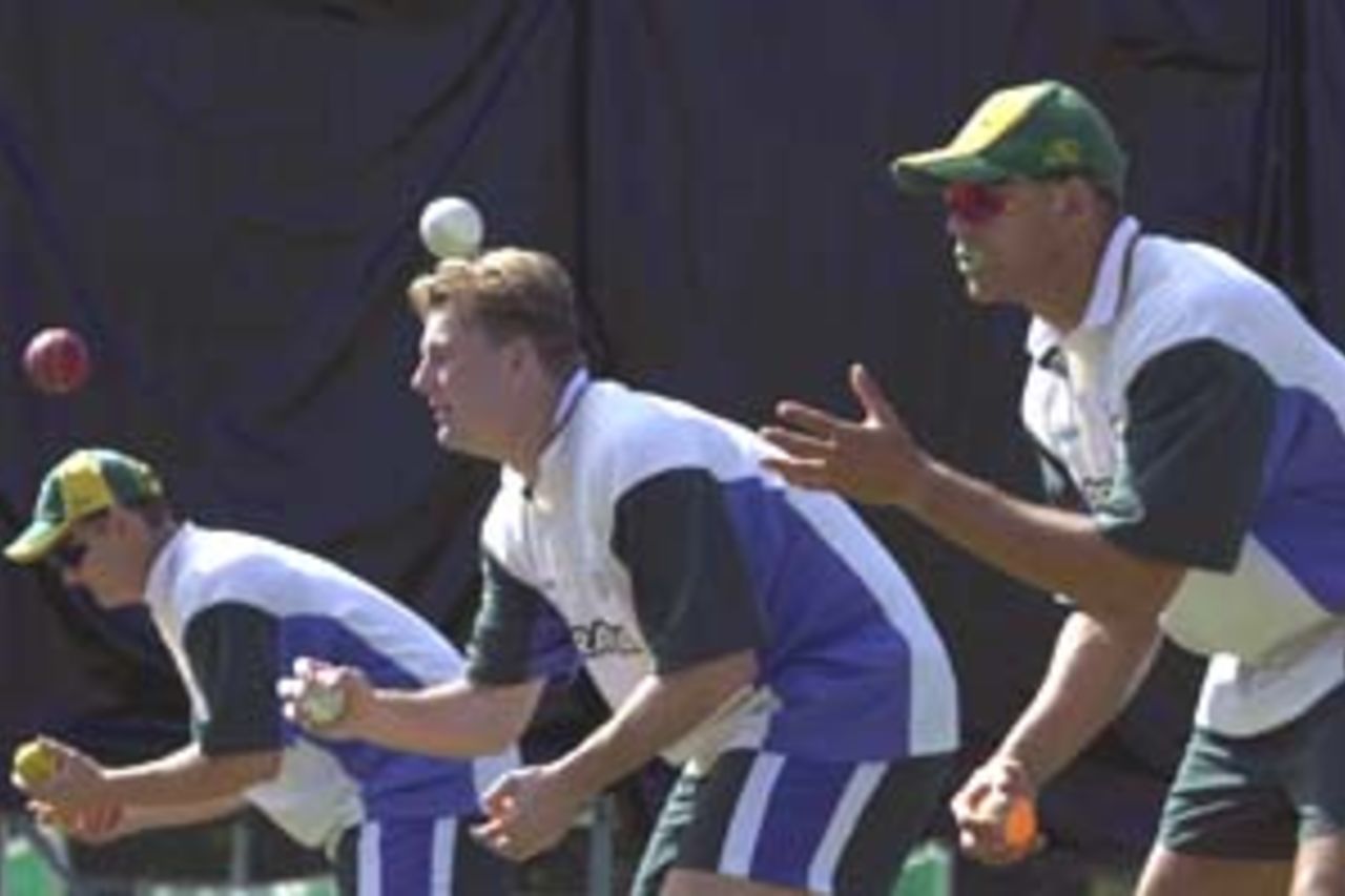 10 Aug 2000: Adam Gilchrist, Shane Lee and Andrew Symonds of Australia in action at training for the Australian Cricket team at Allan Border Field in Brisbane, Australia. The Australian team are preparing for Super Challenge 2000 against South Africa.