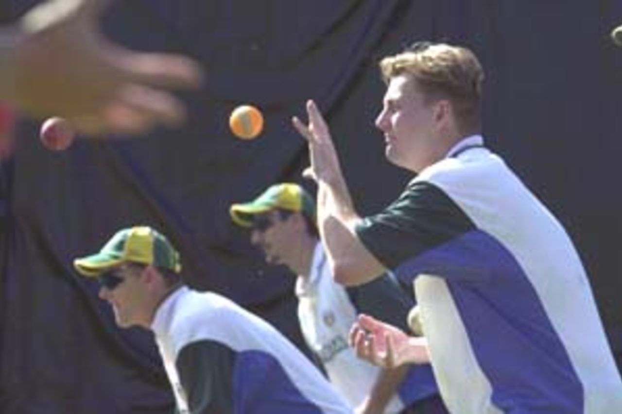 10 Aug 2000: Shane Lee, Adam Gilchrist and Jason Gillespie of Australia in action at training for the Australian Cricket team at Allan Border Field in Brisbane, Australia. The Australian team are preparing for Super Challenge 2000 against South Africa.