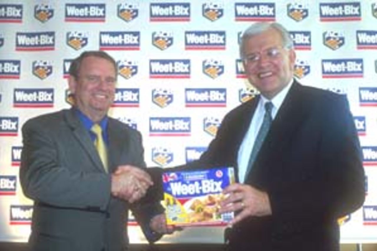 10 Aug 2000: John Davey (National sales and marketing manager) of Sanitarium and Malcolm Speed of the Australian Cricket Board at the announcement of the Weet-Bix sponsorship of the Australian Cricket team held at Allan Border Field in Brisbane, Australia.