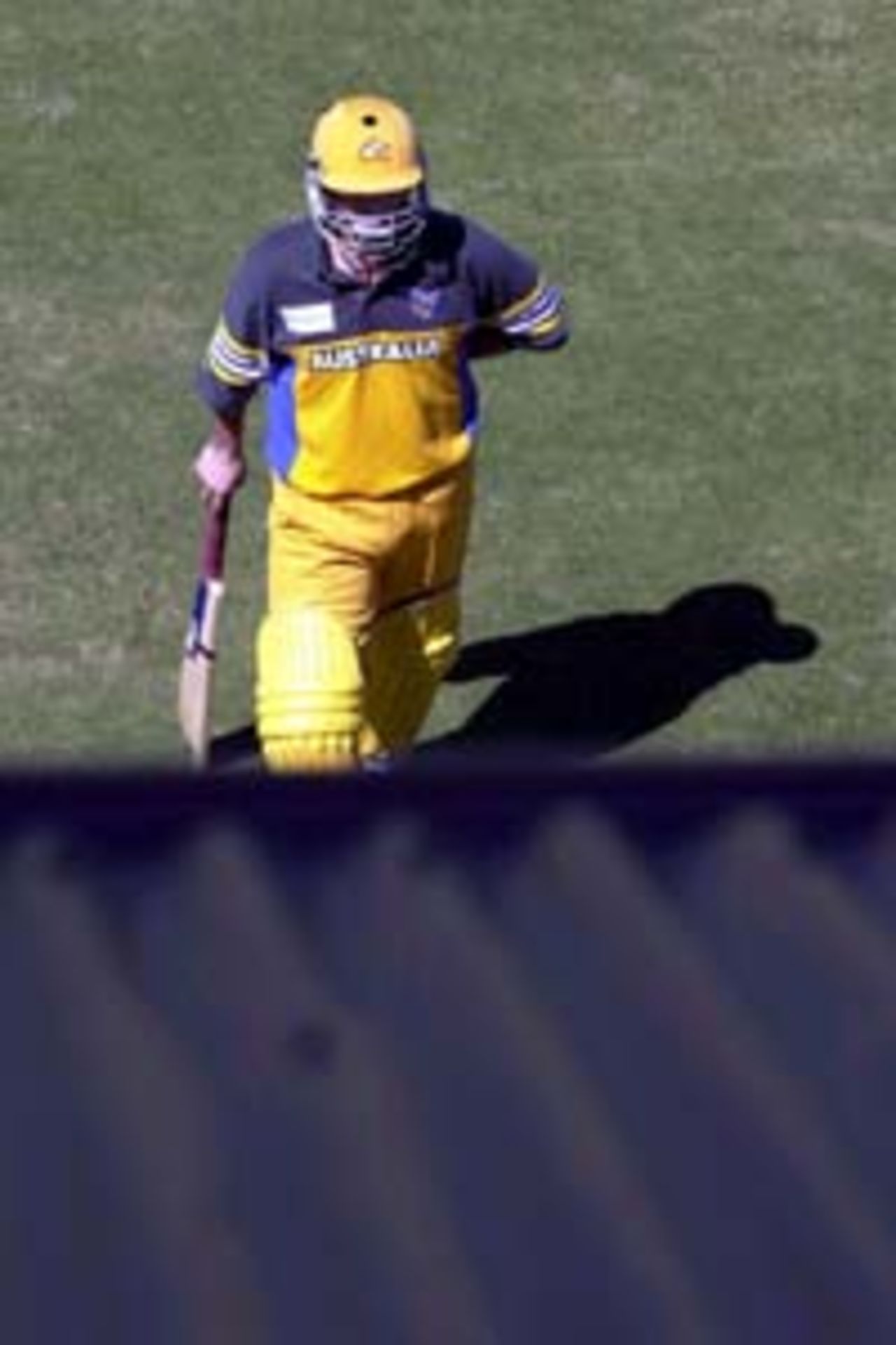 11 Aug 2000: Steve Waugh of Australia comes off the field after losing his wicket to Scott Prestwidge of Queensland during the Australia versus Queensland practice match played at Allan Border Field in Brisbane, Australia. The Australian team are playing the practice match to prepare for the Super Challenge 2000 against South Africa.