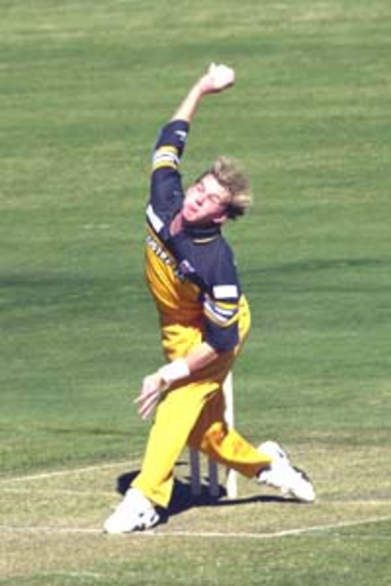 11 Aug 2000: Brett Lee of Australia in action bowling during the Australia versus Queensland practice match played at Allan Border Field in Brisbane, Australia. The Australian team are playing the practice match to prepare for the Super Challenge 2000 against South Africa.