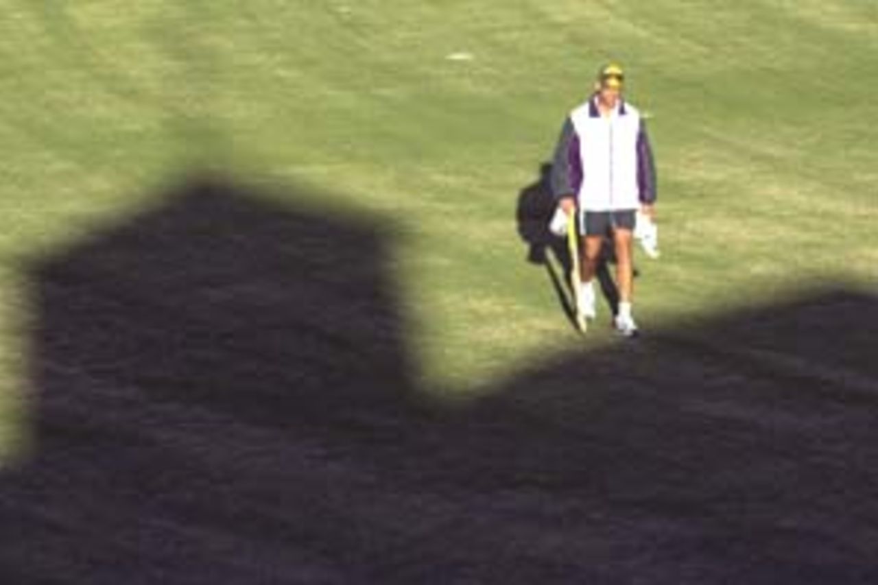 12 Aug 2000: Andrew Symonds of Australia walks back to the pavilion after training for the Australian Cricket Team at Allan Border Field in Brisbane, Australia. The Australian team are preparing for the upcoming Super Challenge 2000 series against South Africa.