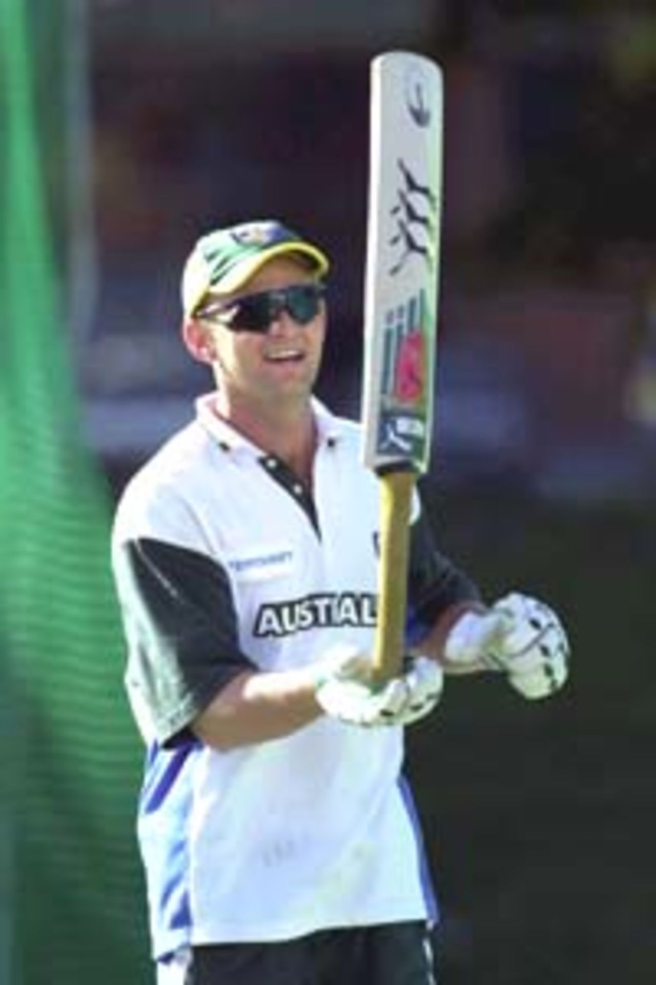 12 Aug 2000: Adam Gilchrist of Australia balancing a bat at training for the Australian Cricket Team at Allan Border Field in Brisbane, Australia. The Australian team are preparing for the upcoming Super Challenge 2000 series against South Africa.