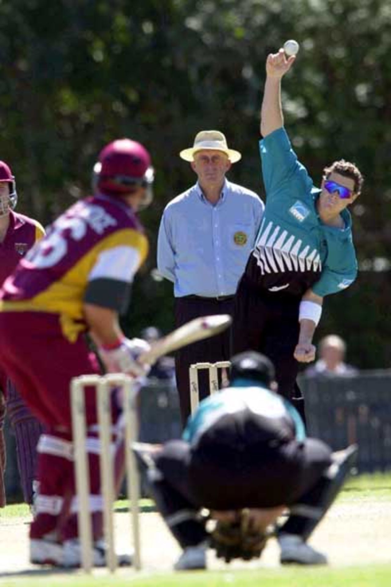 15 Aug 2000: Paul Wiseman of New Zealand in action bowling to Scott Prestwidge of Queensland during the New Zealand versus Queensland practice match at Allan Border Field in Brisbane, Australia.