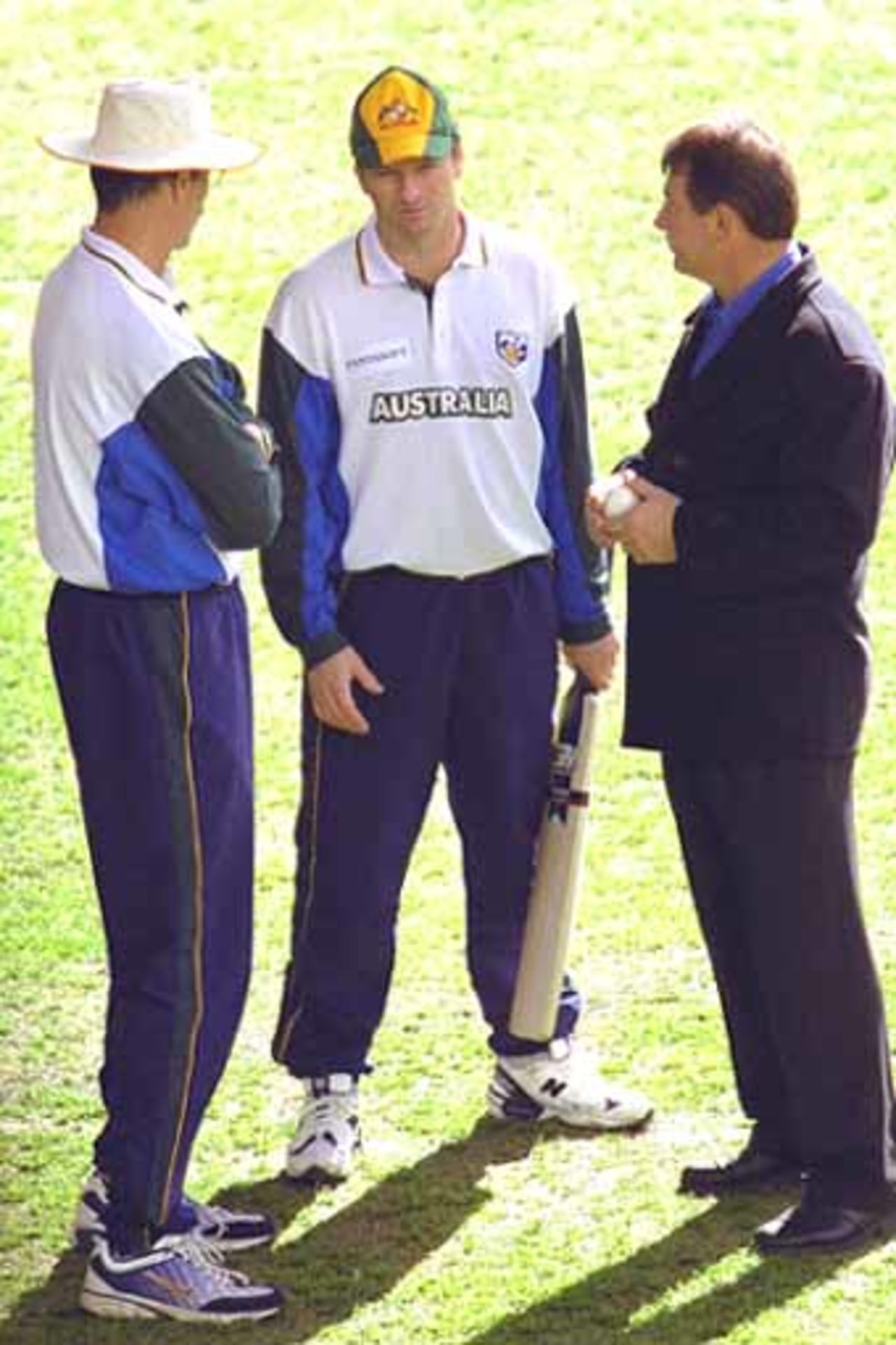 15 Aug 2000: Australian Captain Steve Waugh (centre) chats with current coach John Buchanan (left) and former coach Geoff Marsh on Colonial Stadium, venue for the Super Challenge 2000 one day cricket series beginning Wednesday in Melbourne, Australia.