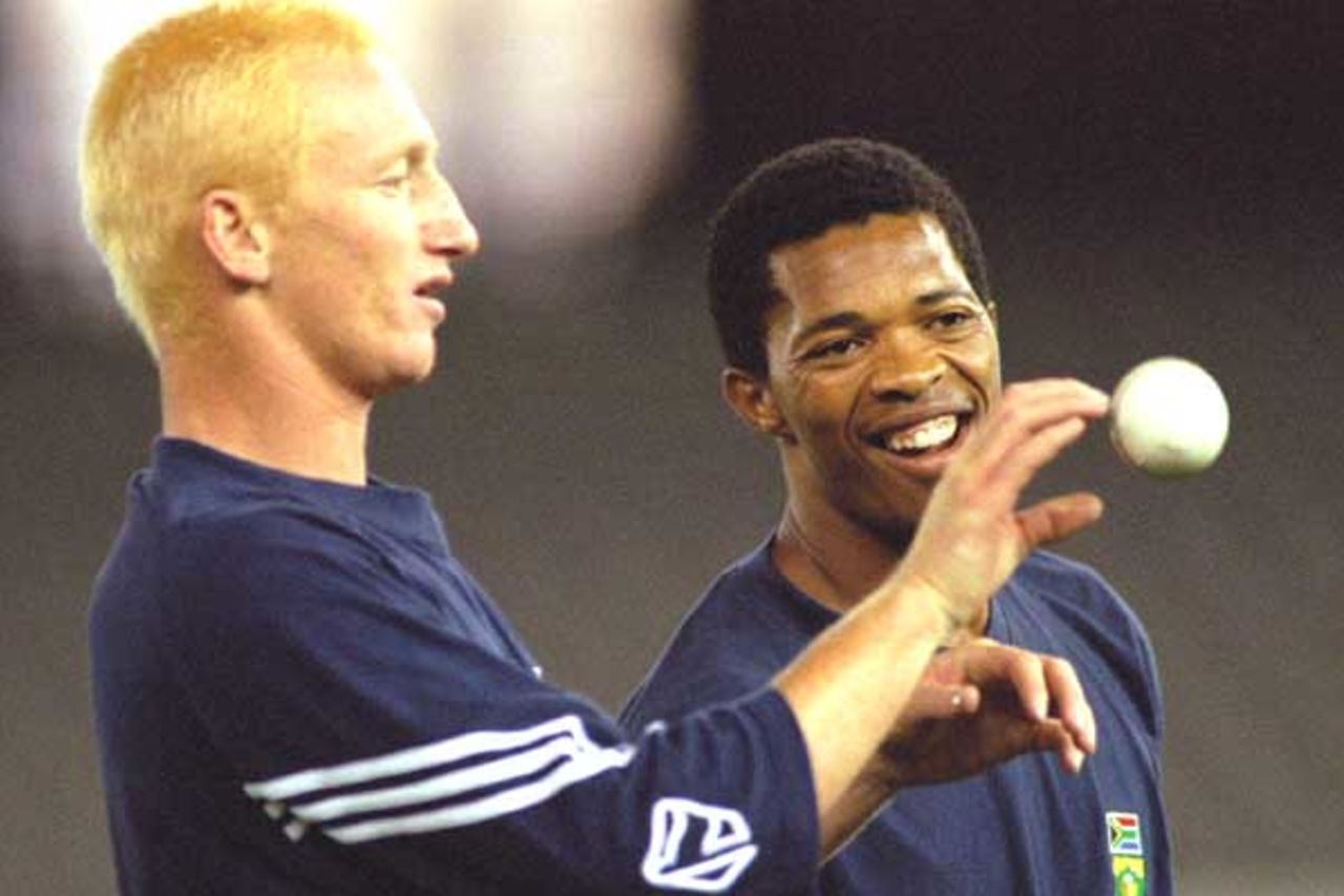 15 Aug 2000: Mornantau Hayward (left) and Makhaya Ntini of South Africa share a joke during training on Colonial Stadium, venue for the Super Challenge 2000 one day cricket series beginning Wednesday in Melbourne, Australia.