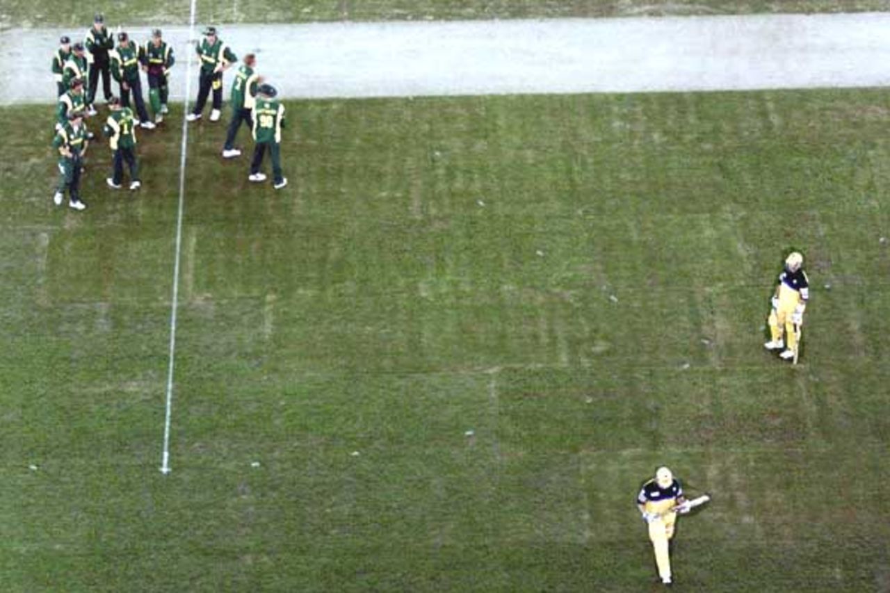 16 Aug 2000: South African players celebrate the wicket of Adam Gilchrist of Australia, in the match between Australia and South Africa, in game one of the Super Challenge 2000, played at Colonial Stadium in Melbourne, Australia. This is the first game of cricket to be played indoors.