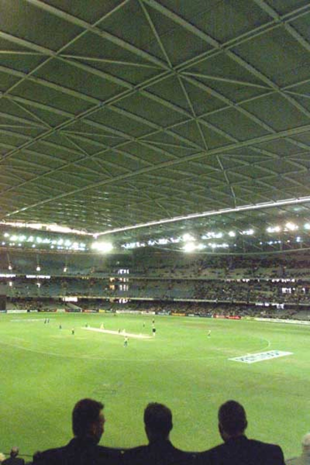 16 Aug 2000: Fans watch the match between Australia and South Africa, in game one of the Super Challenge 2000, played at Colonial Stadium in Melbourne, Australia. This is the first game of cricket to be played indoors.