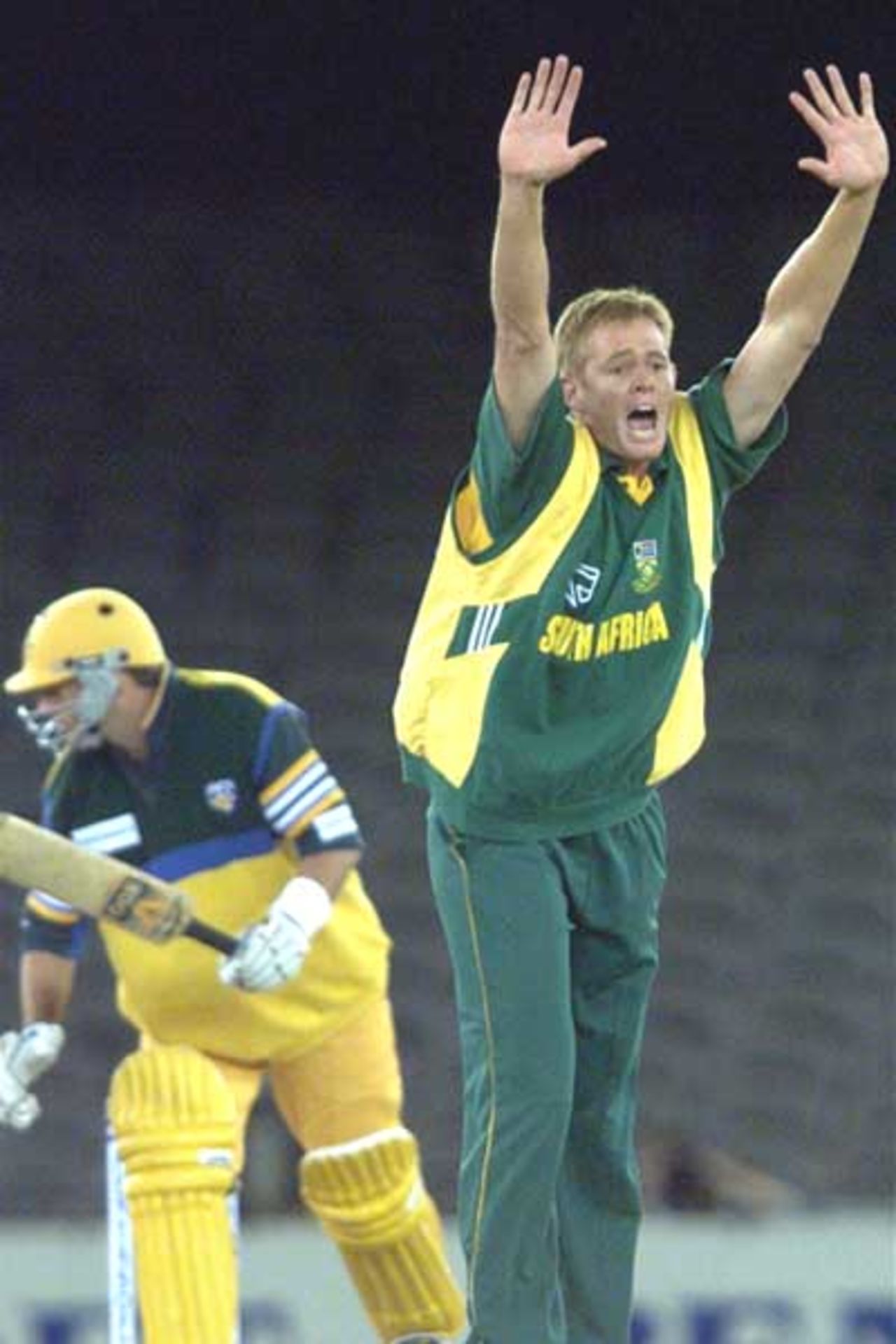 16 Aug 2000: Shaun Pollock of South Africa appeals for the wicket of Mark Waugh of Australia during game one of the Super Challenge 2000 between Australia and South Africa, played at Colonial Stadium in Melbourne, Australia. This is the first game of cricket to be played indoors.