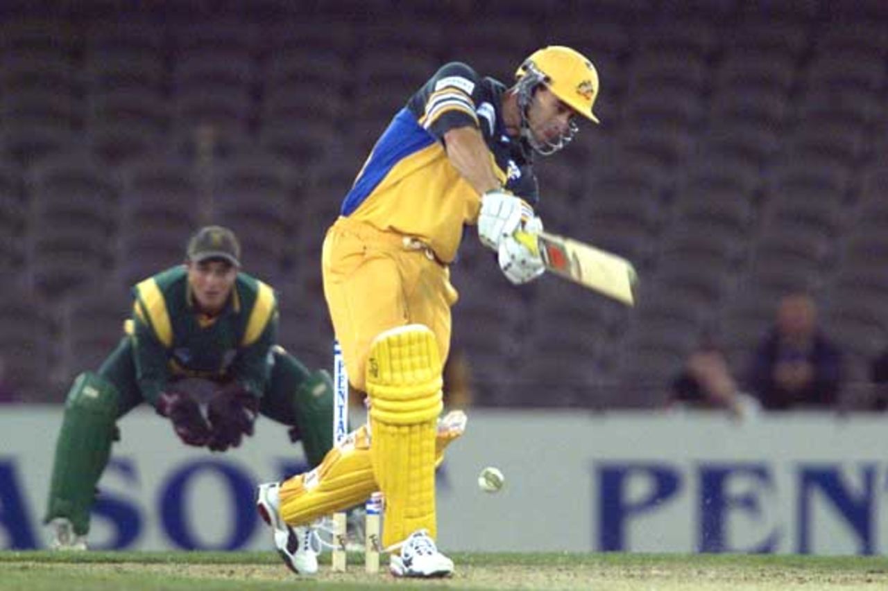 16 Aug 2000: Michael Bevan of Australia in action in the match between Australia and South Africa, in game one of the Super Challenge 2000, played at Colonial Stadium in Melbourne, Australia. This is the first game of cricket to be played indoors.