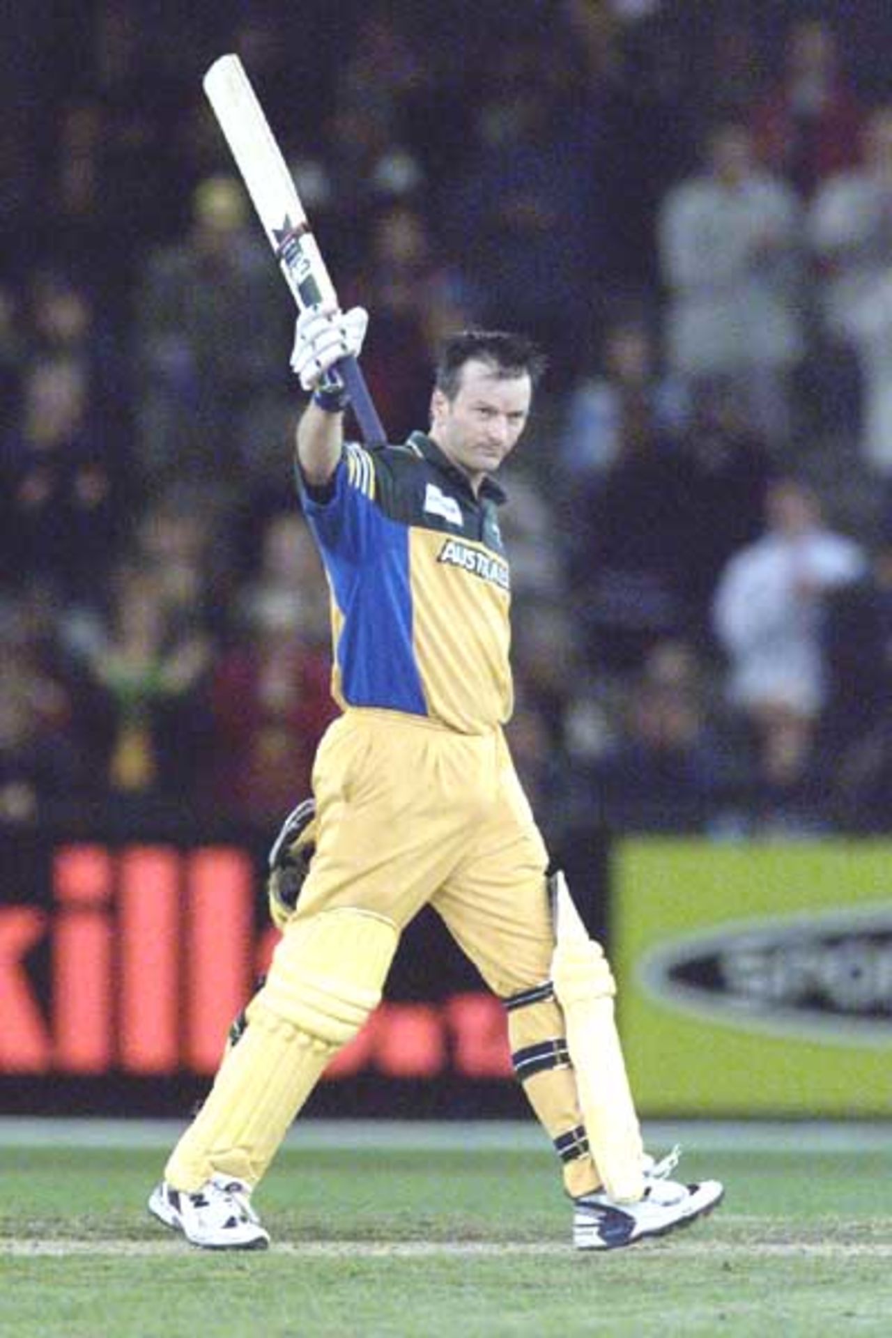 16 Aug 2000: Steve Waugh of Australia celebrates making 100 runs, in the match between Australia and South Africa, in game one of the Super Challenge 2000, played at Colonial Stadium in Melbourne, Australia. This is the first game of cricket to be played indoors.