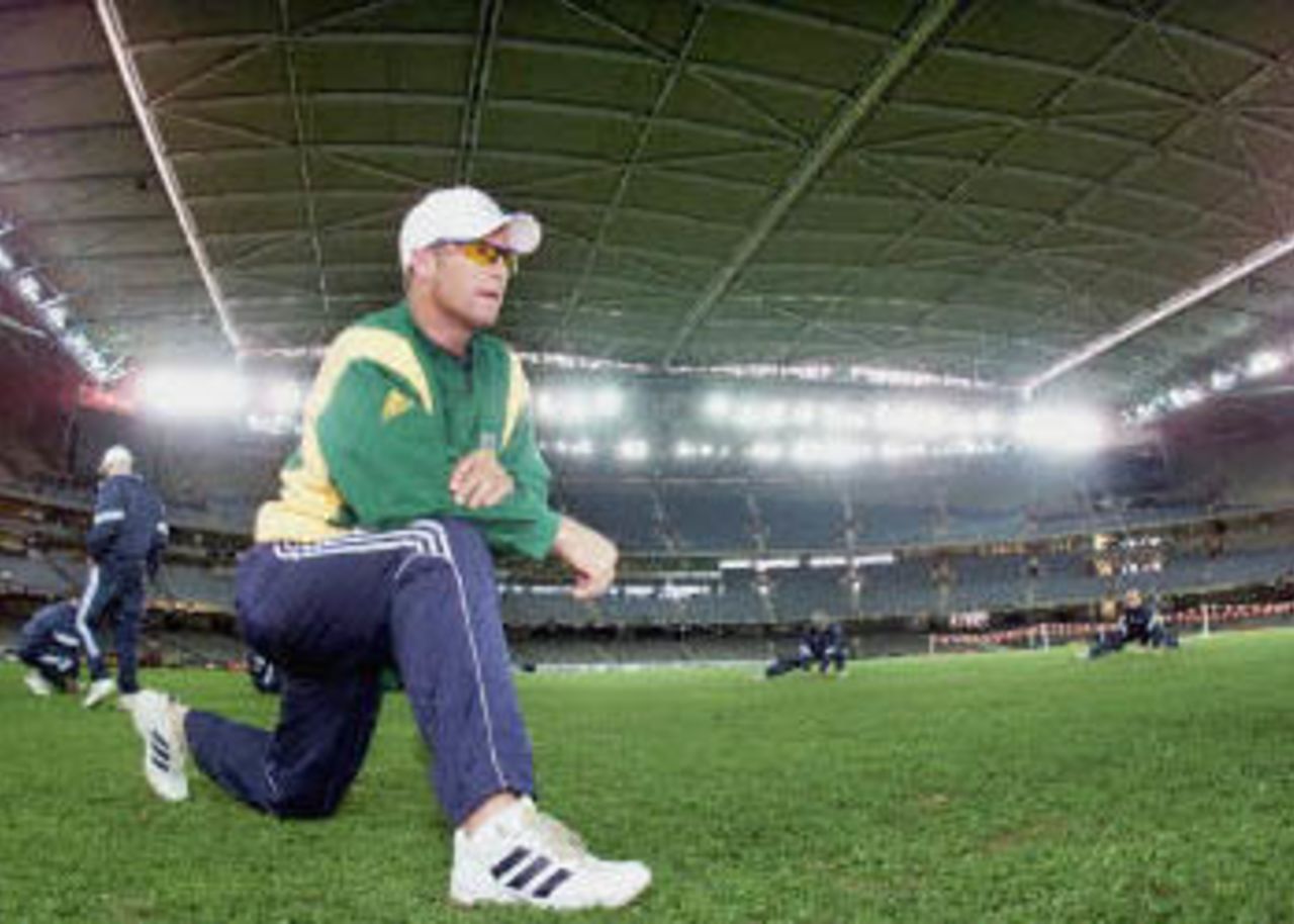South African batsman Jonty Rhodes goes through his stretching exercises (15 August 2000) in preparation for the Australia versus South Africa match that will played under the closed roof of the Colonial Stadium in Melbourne. Australia and South Africa will create history when they play the first one-day cricket matches indoors when they meet 16, 18 and 20 August. Super Challenge 2000.