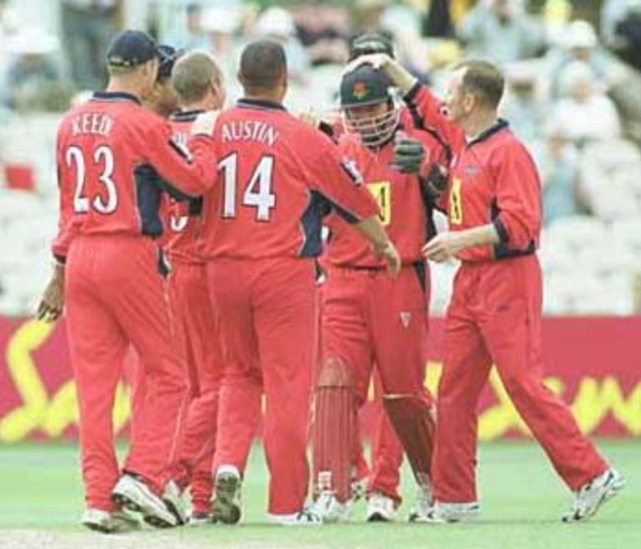 Hegg congratulated by teammates on taking 200 catches in Sunday League, National League Division One, 2000, Lancashire v Gloucestershire, Old Trafford, Manchester, 11 August 2000.