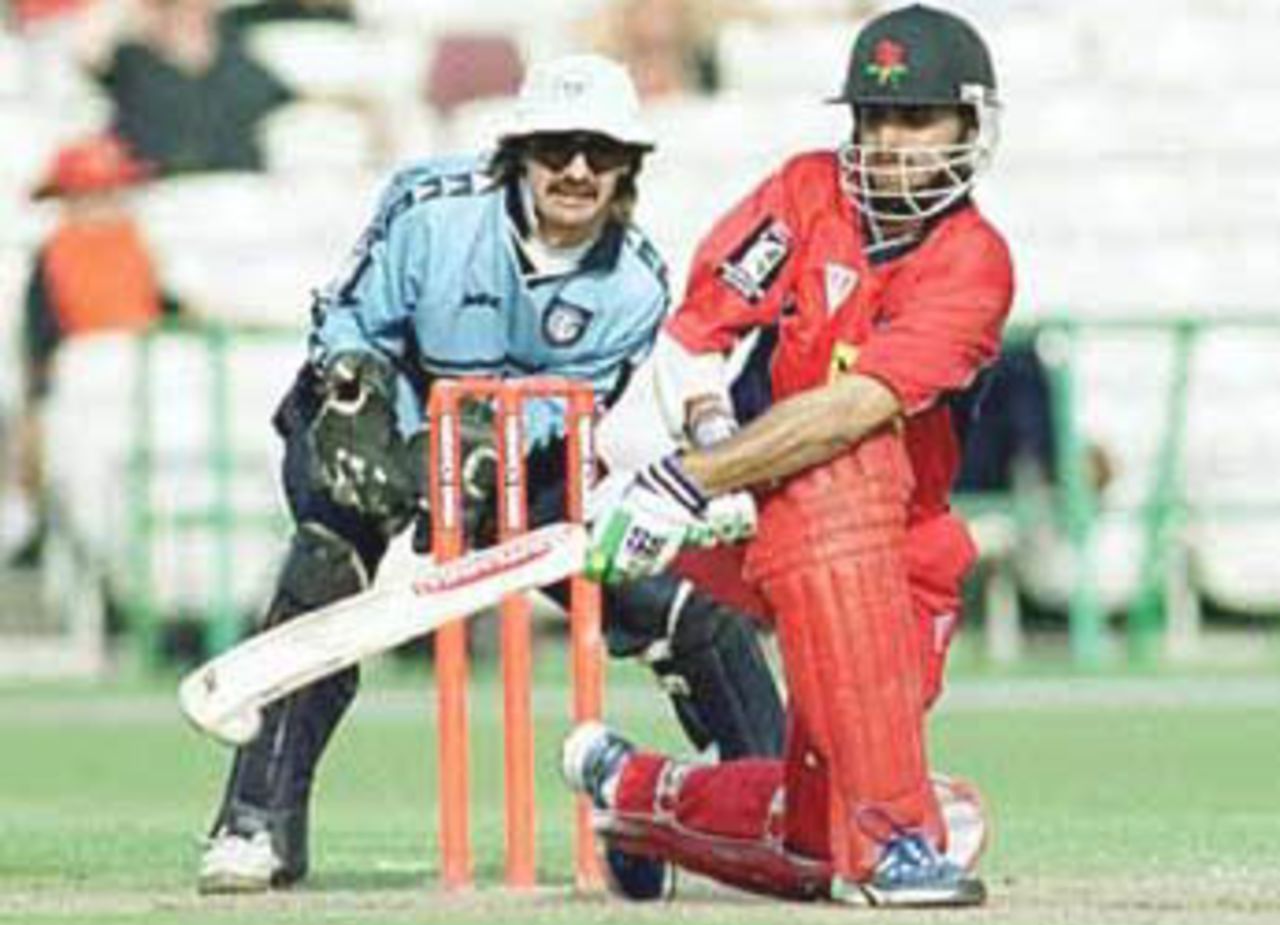 Ganguly executes the sweep as Keeper Russell looks on, National League Division One, 2000, Lancashire v Gloucestershire, Old Trafford, Manchester, 11 August 2000.