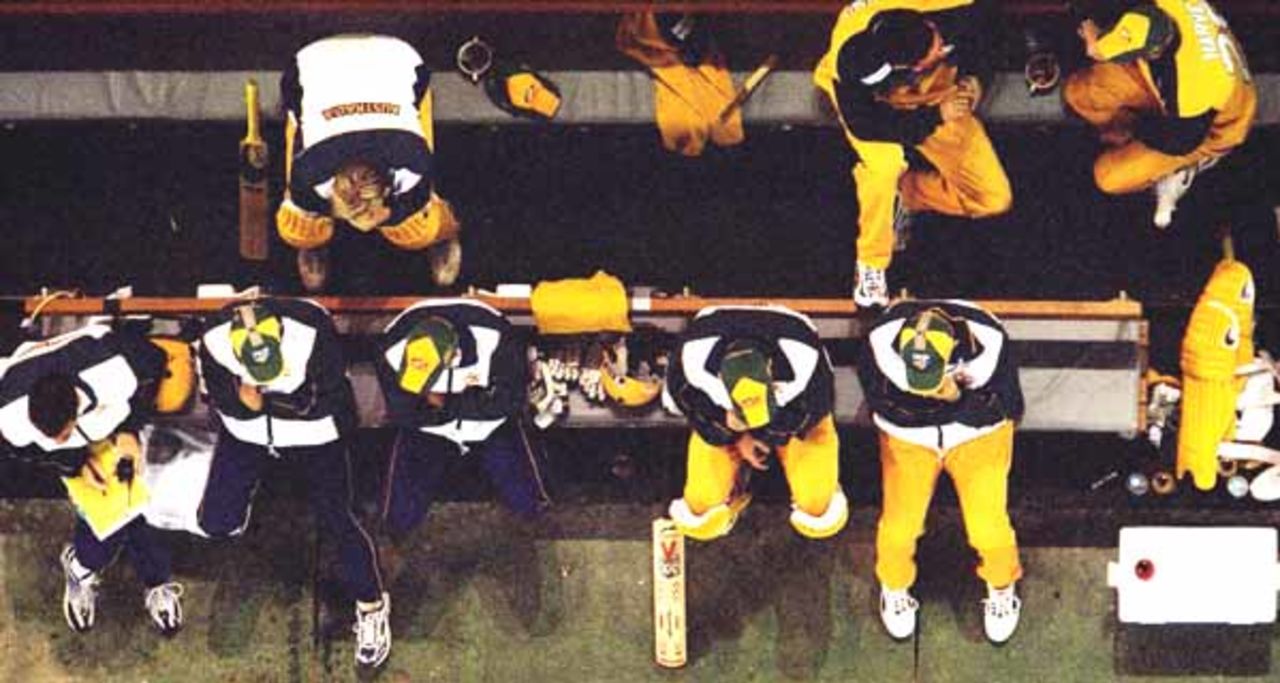 16 Aug 2000: The Australian team watch on from the boundary during game one of the Super Challenge 2000, played at Colonial Stadium in Melbourne, Australia. This is the first game of cricket to be played indoors.