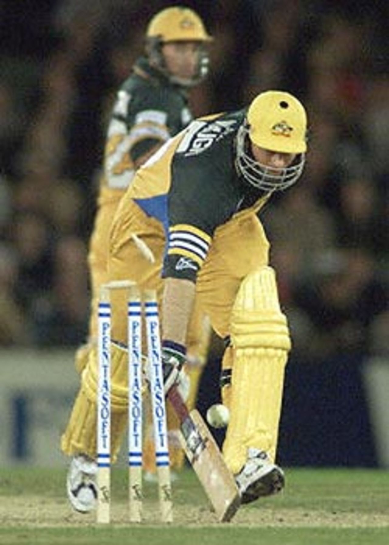Australian captain Steve Waugh (R) makes his ground as teammate Michael Bevan looks on in the first one day cricket match in history to be played under a closed roof at the Colonial Stadium as Australia takes on South Africa in Melbourne. Being played in the middle of winter in Melbourne, Australia is 190-3 in the 39th over with captain Steve Waugh and Michael Bevan at the wicket. South Africa in Australia, 2000/01, 1st One-Day International, Australia v South Africa, Colonial Stadium, Melbourne, 16 August 2000.