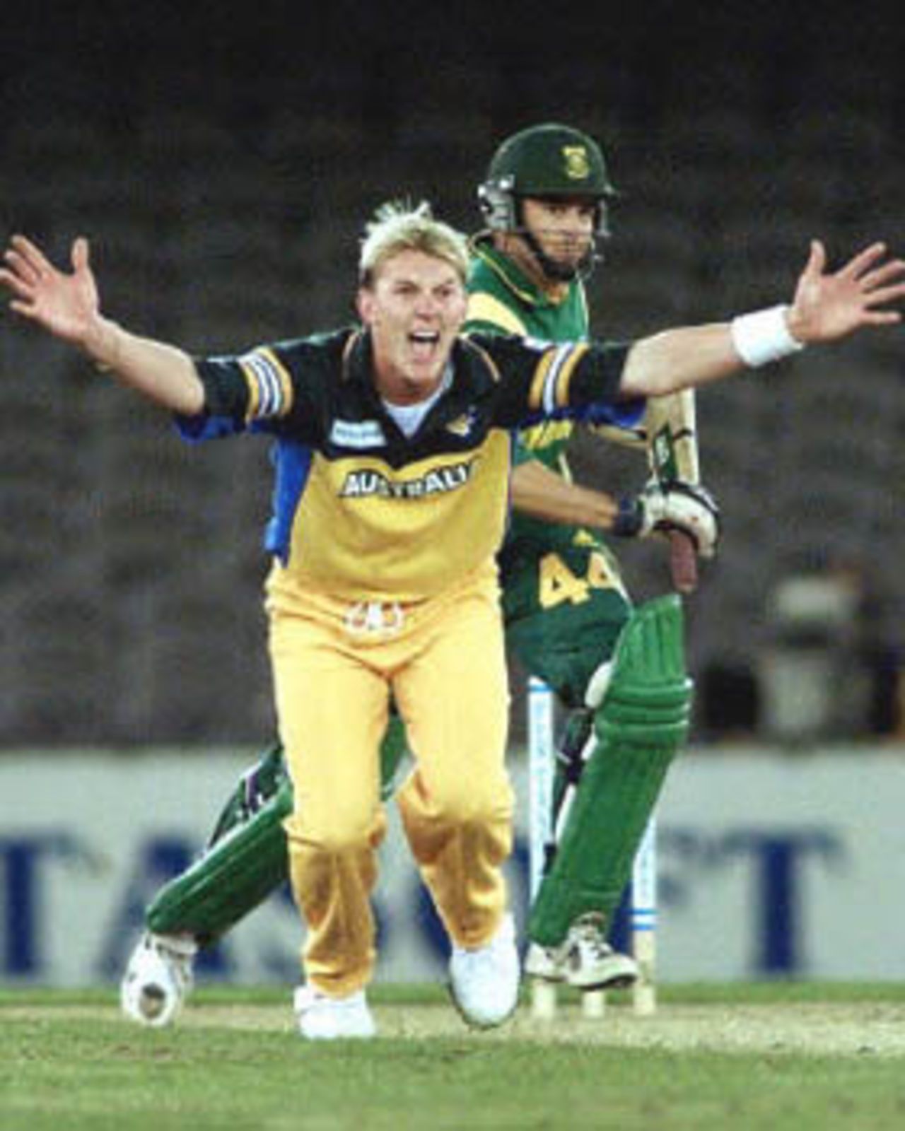 Australian paceman Brett Lee (L) appeals for an LBW decision against South Africa's Neil McKenzie (R) in the first one day cricket match in history to be played under a closed roof at Colonial Stadium in Melbourne as Australia takes on South Africa. Being played in the middle of winter in Melbourne, Australia scored 295-5 in their 50 overs and restricted South Africa to 201-7 in their 50 overs to win the match comfortably. South Africa in Australia, 2000/01, 1st One-Day International, Australia v South Africa, Colonial Stadium, Melbourne, 16 August 2000.