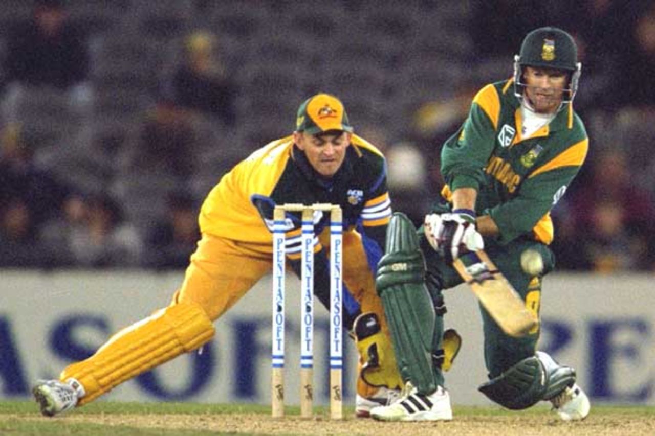 16 Aug 2000: Jonty Rhodes of South Africa plays a reverse sweep to be caught by Damien Martyn of Australia, in the match between Australia and South Africa, in game one of the Super Challenge 2000, played at Colonial Stadium in Melbourne, Australia. This is the first game of cricket to be played indoors.