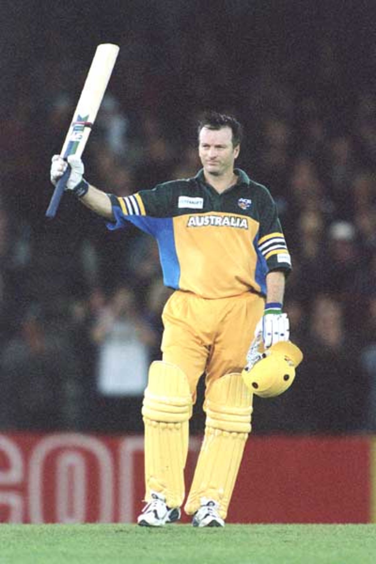 16 Aug 2000: Steve Waugh waves to the crowd, after scoring a century, during game one of the Super Challenge 2000 between Australia and South Africa, played at Colonial Stadium in Melbourne, Australia. This is the first game of cricket to be played indoors.