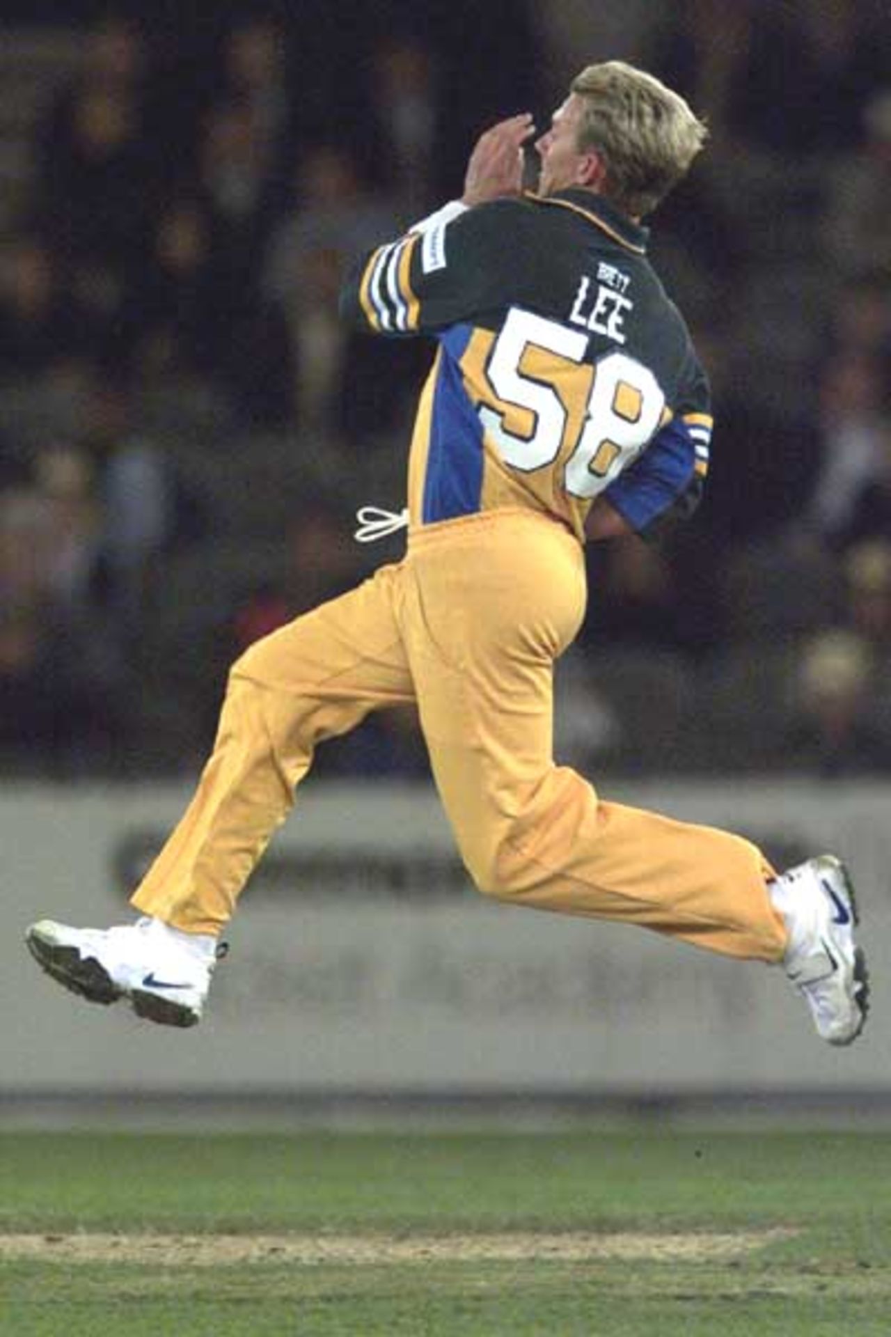 16 Aug 2000: Brett Lee of Australia comes in to bowl in the match between Australia and South Africa, in game one of the Super Challenge 2000, played at Colonial Stadium in Melbourne, Australia. This is the first game of cricket to be played indoors.
