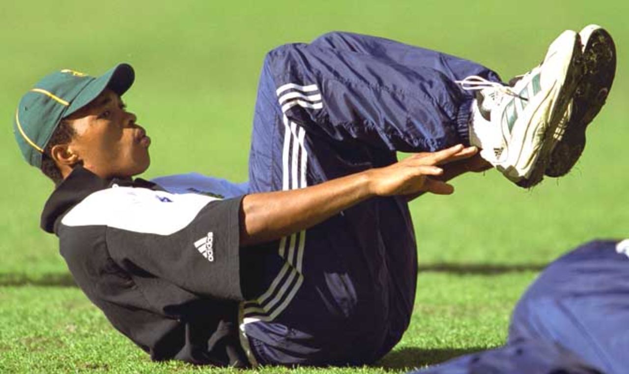 17 Aug 2000: Makhaya Ntini of South Africa, stretches, during training for the Super Challenge 2000 between Australia and South Africa at Colonial Stadium in Melbourne, Australia.