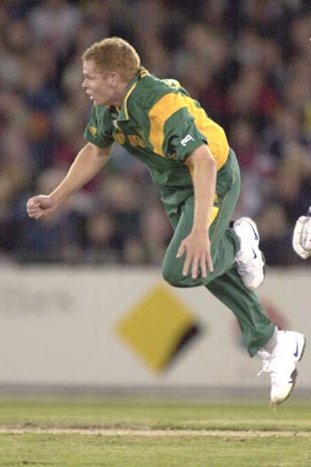 18 Aug 2000: Shaun Pollock of South Africa in full flight after releasing a delivery in the match between Australia and South Africa, in game two of the Super Challenge 2000 played at the Colonial Stadium, Melbourne, Australia.